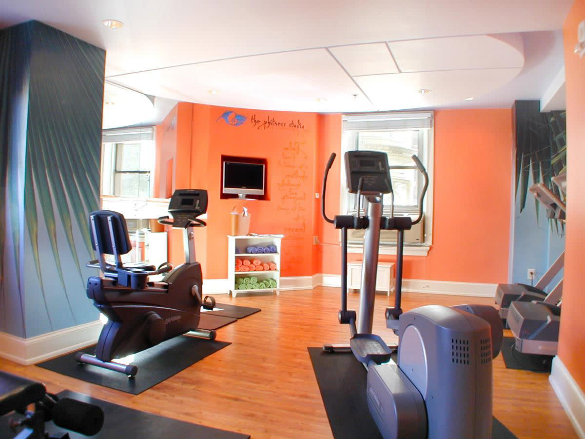 a desk with a computer in an office chair in a room