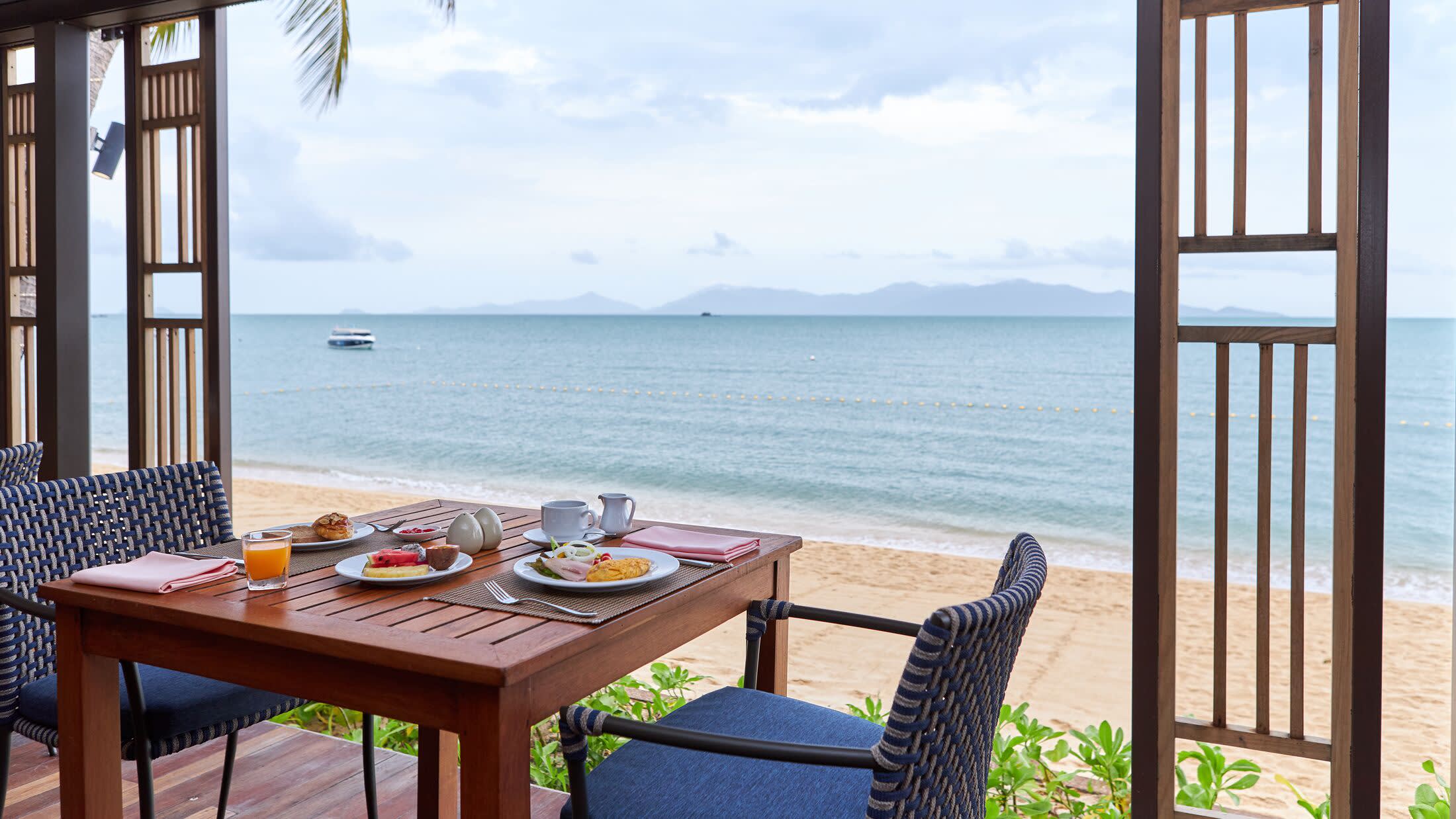 a chair sitting in front of a body of water