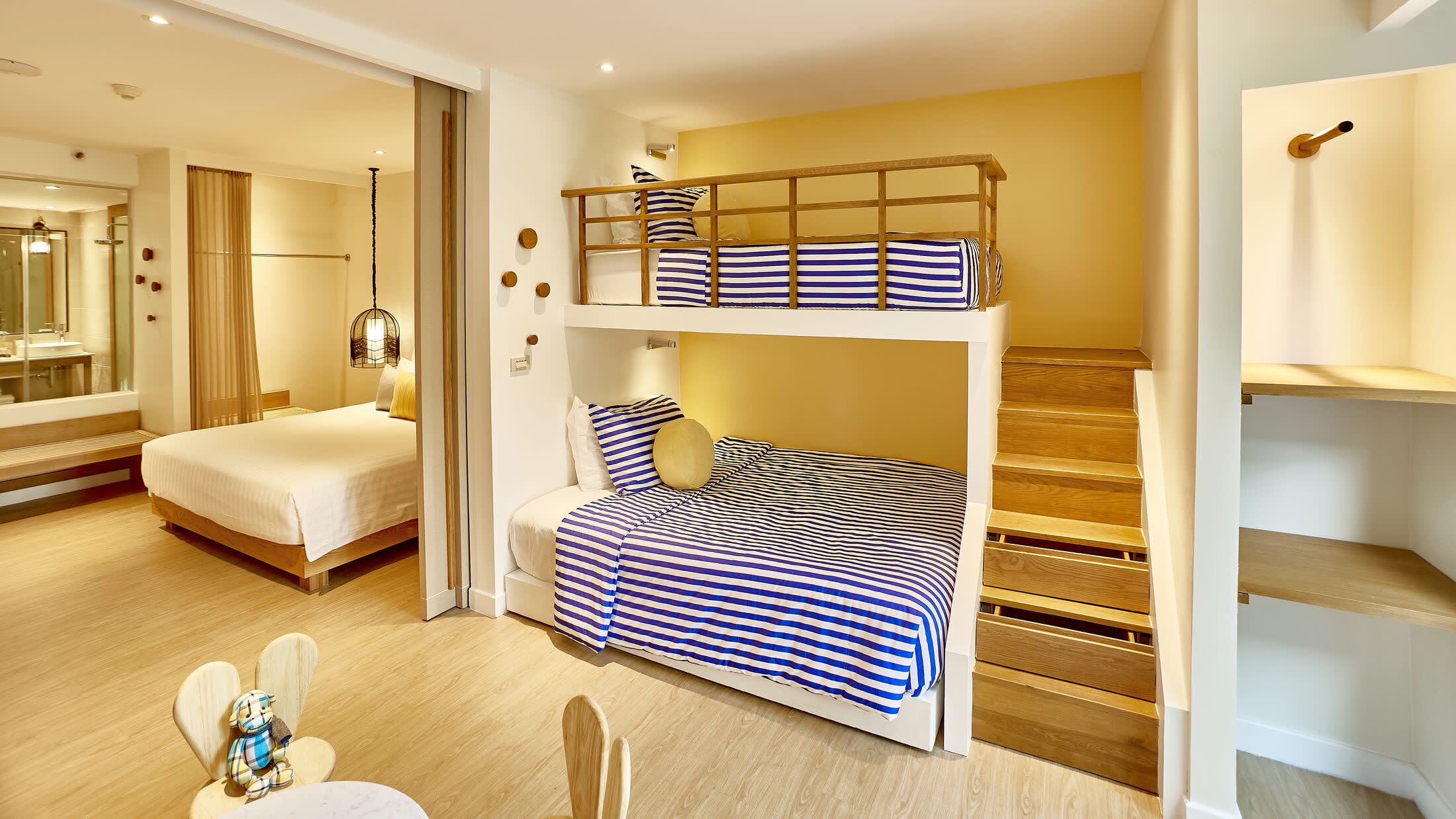 a bedroom with a bed and a mirror in a room