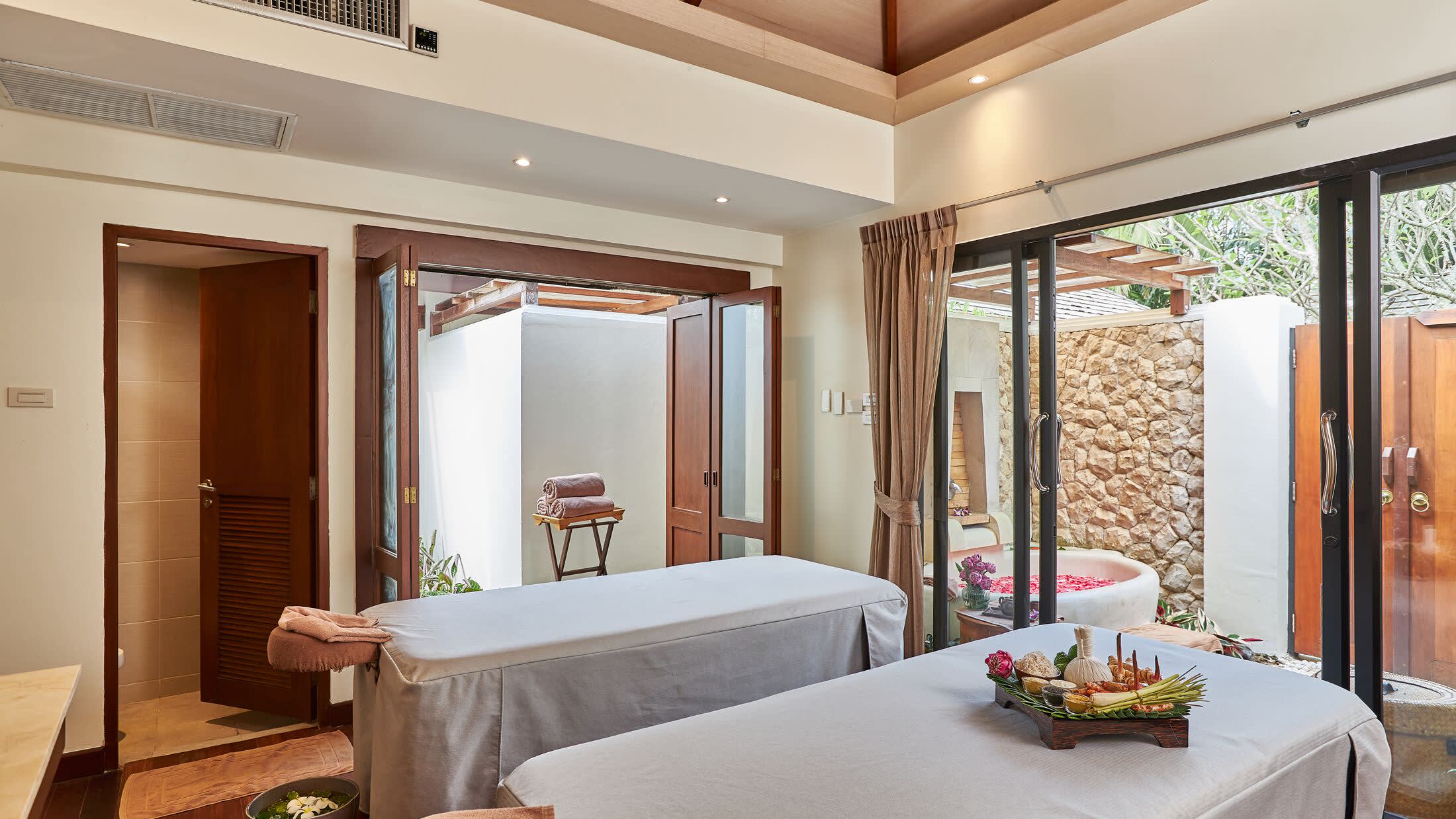 a bedroom with a large window