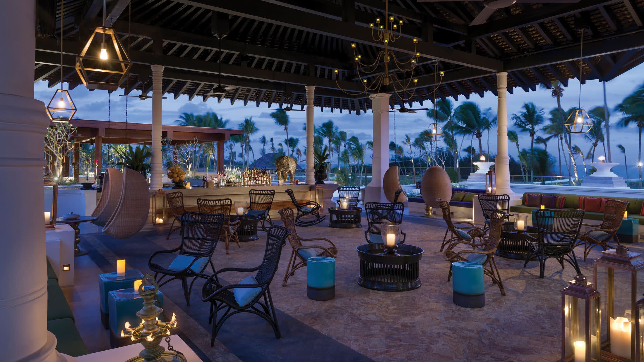 a group of people sitting at a table in front of a building
