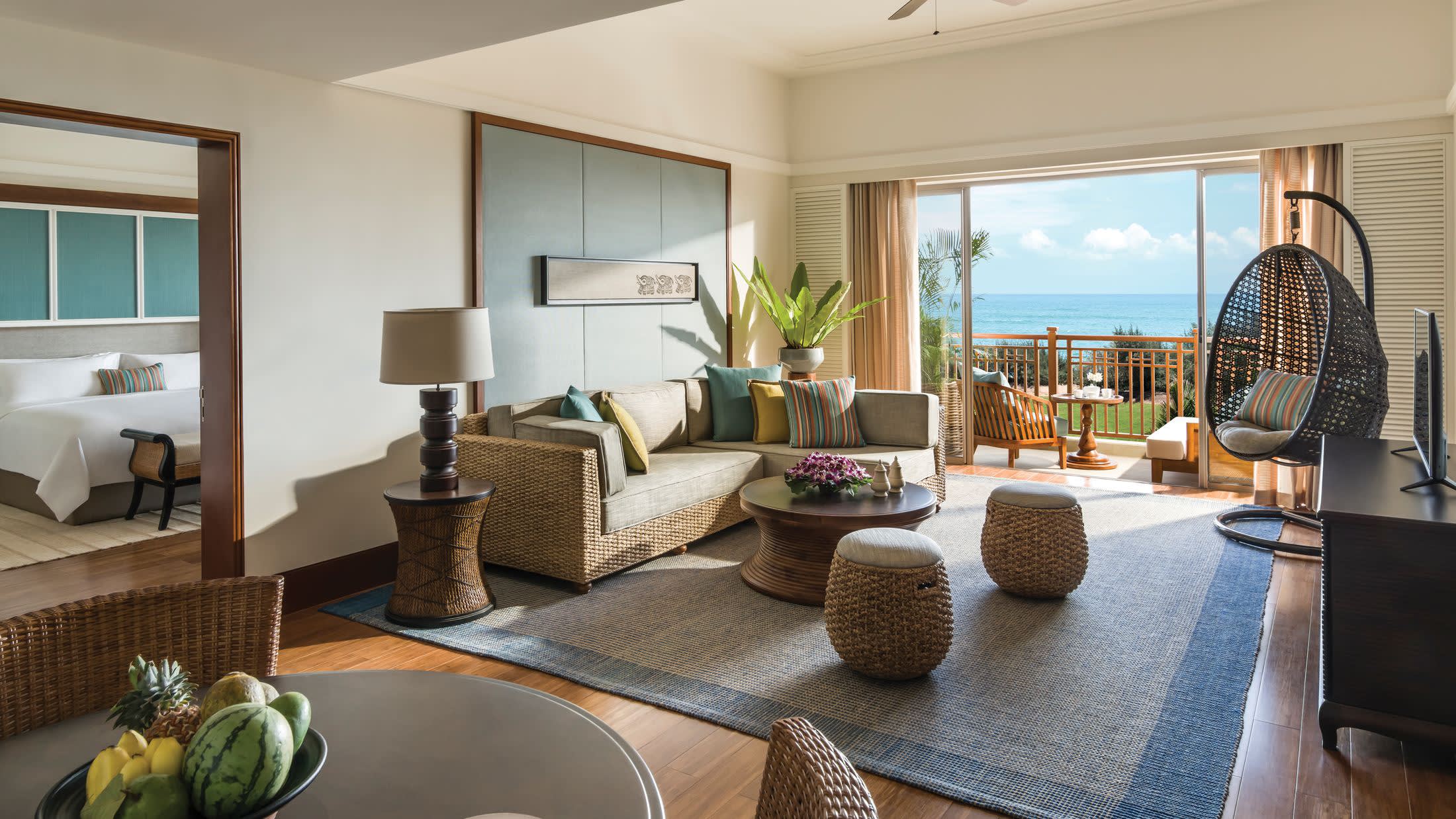 a living room filled with furniture and a large window