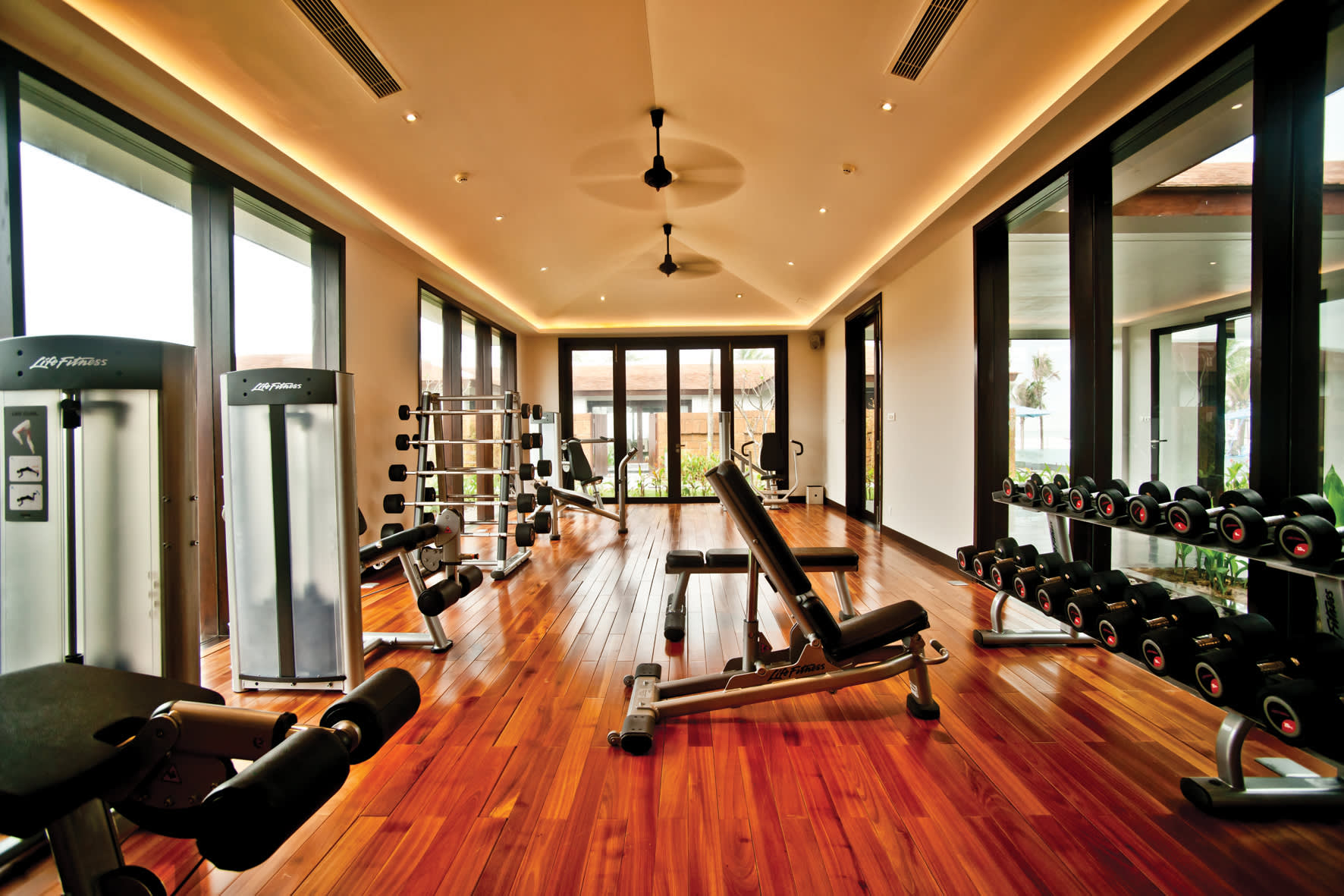 a view of a living room filled with furniture and a large window