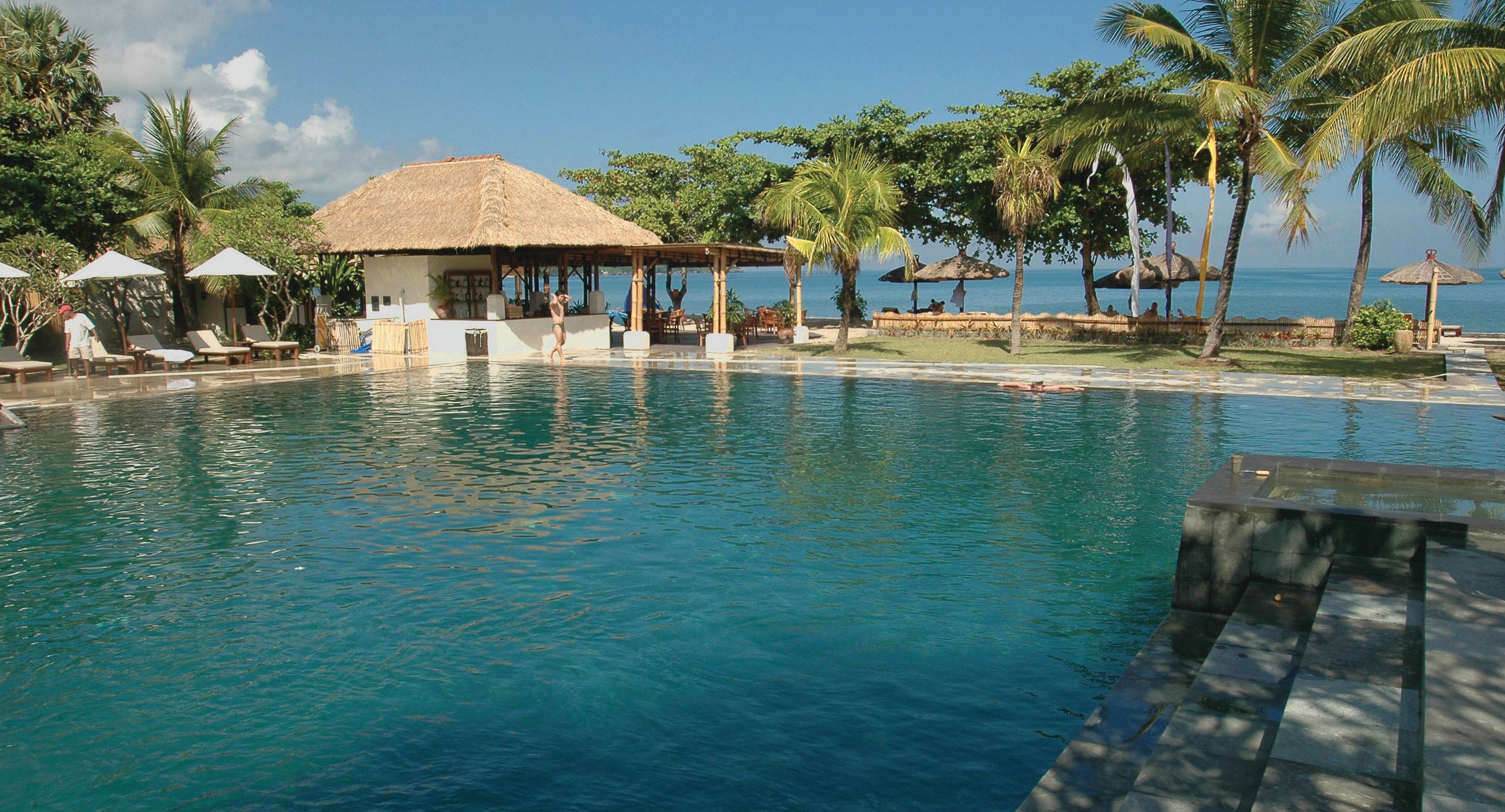 a group of people in a pool of water
