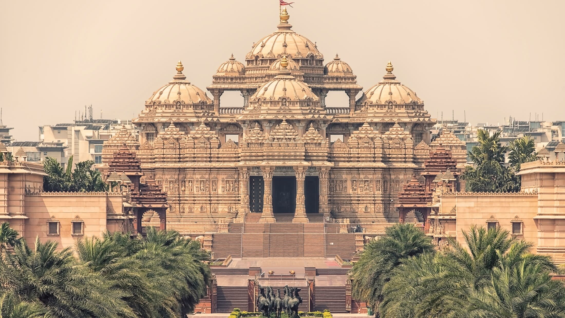 a large building with Akshardham in the background