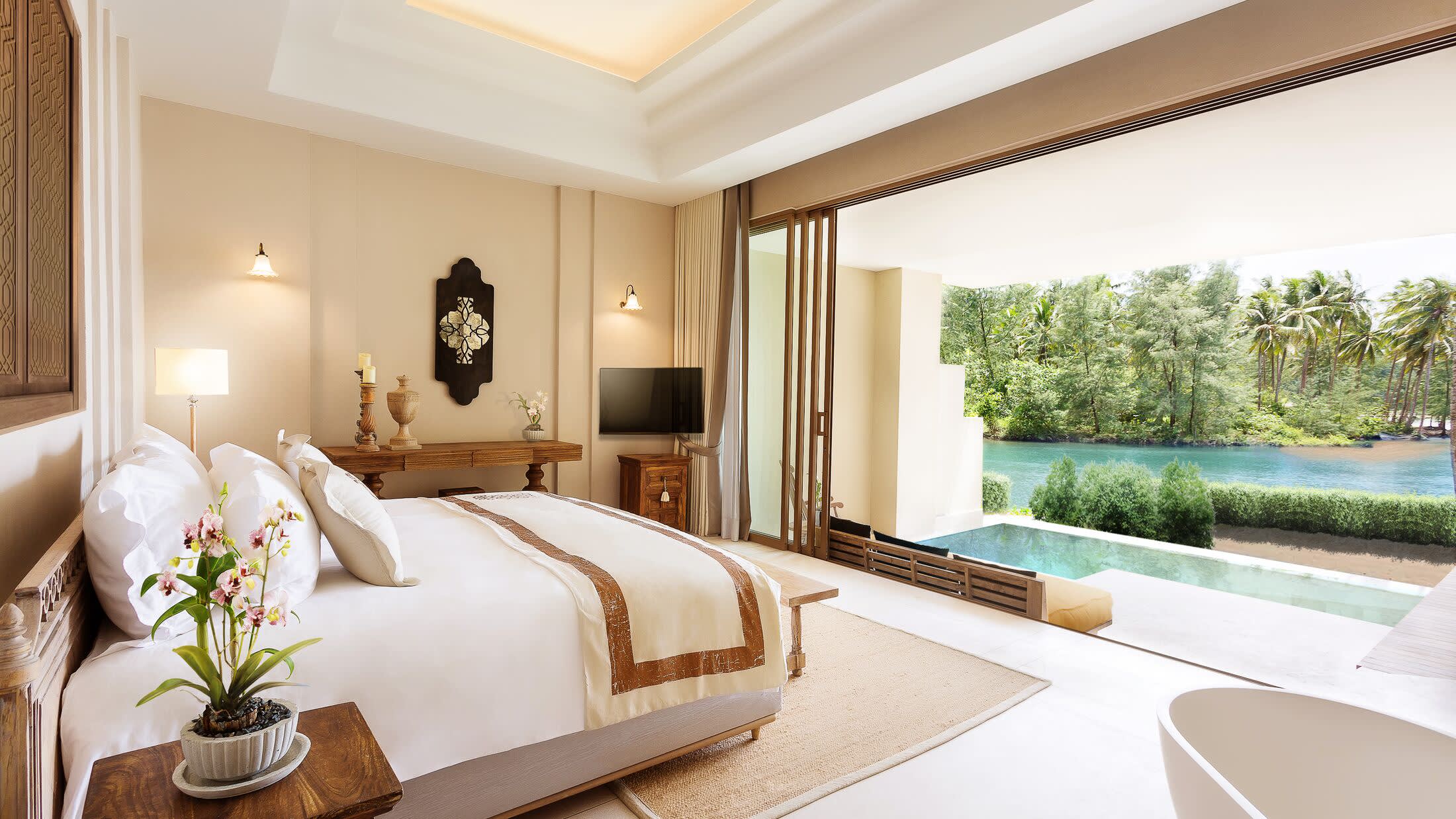 a room filled with furniture and vase of flowers on a table