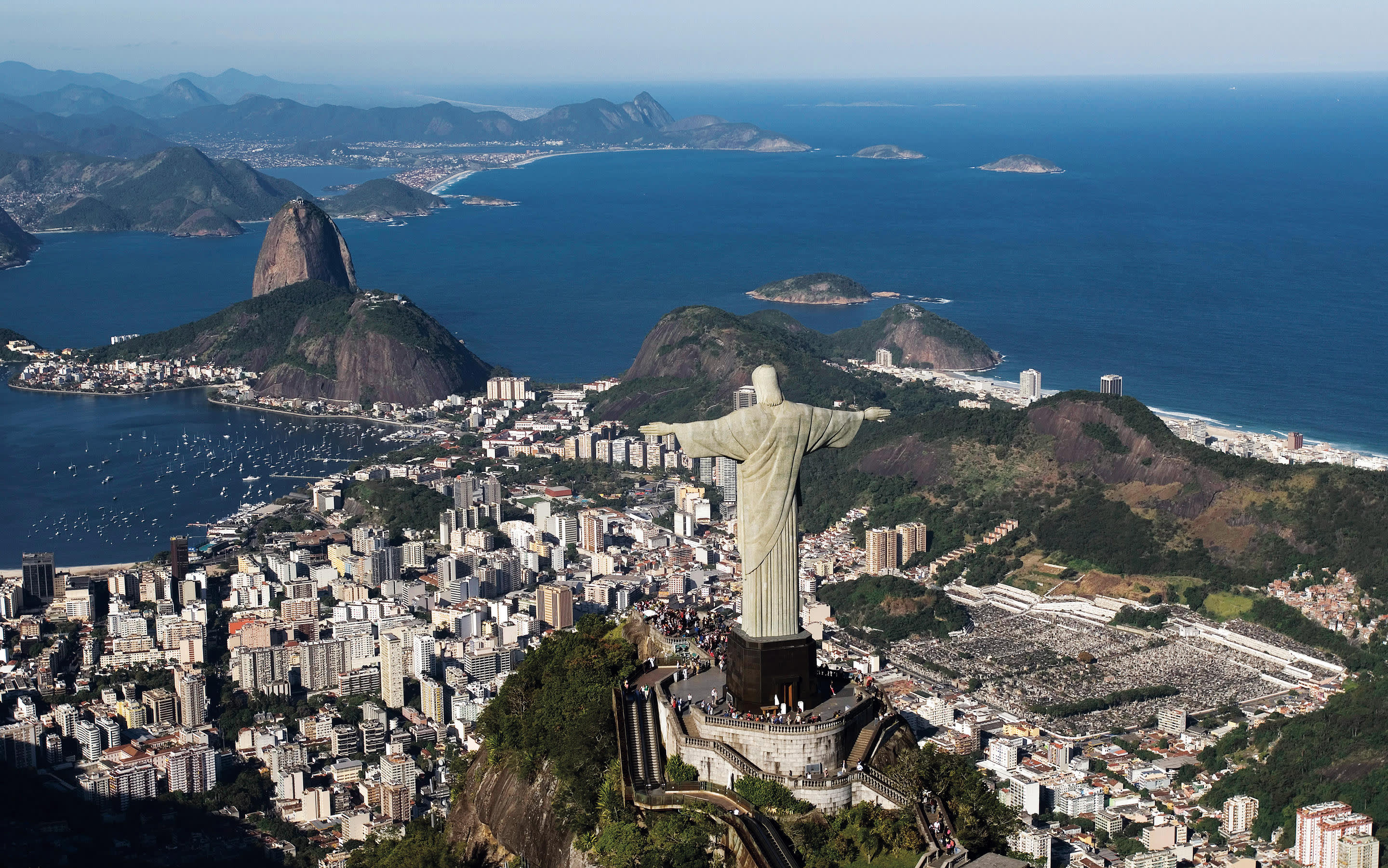 a view of a large body of water with a mountain in the background