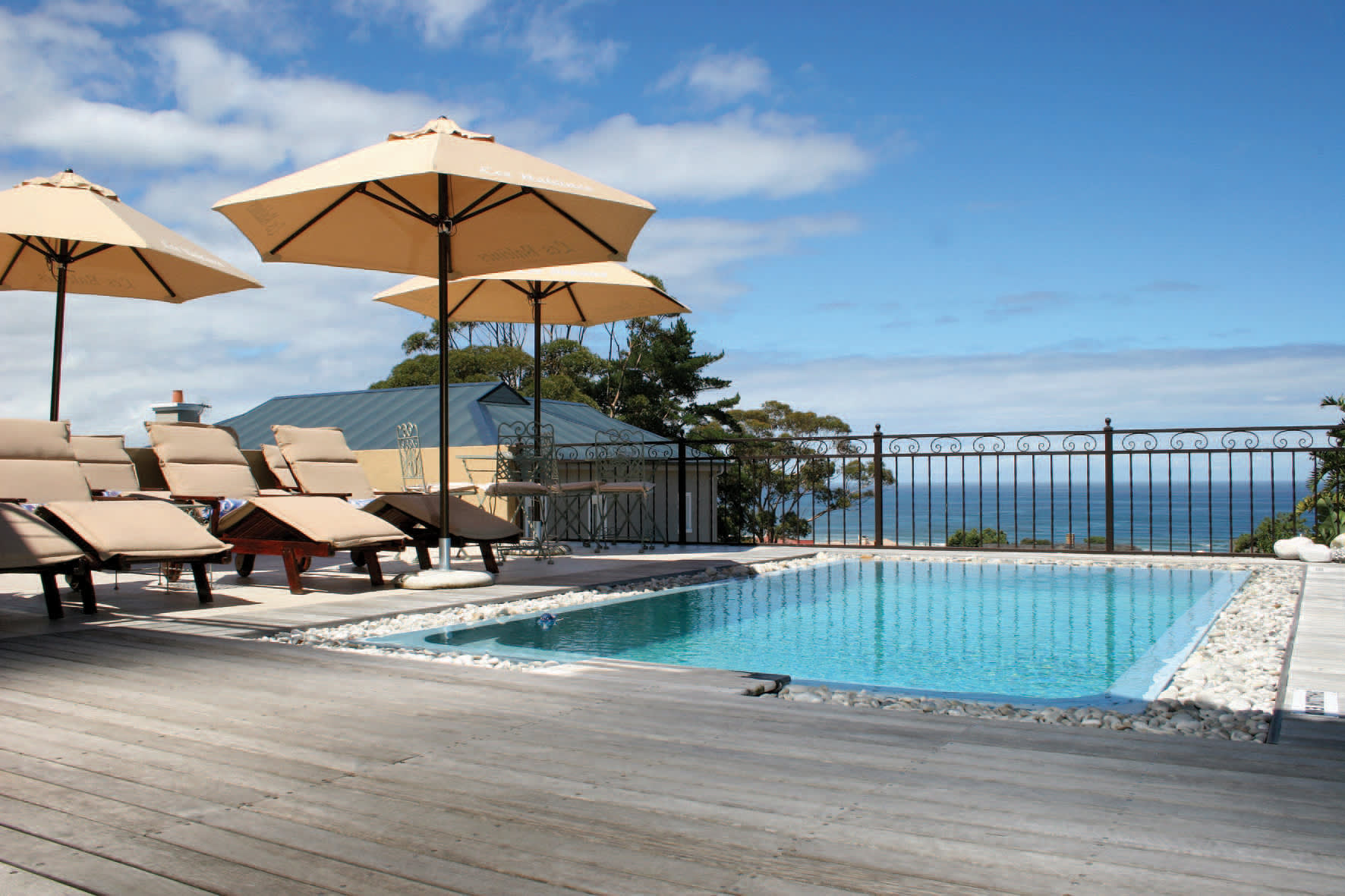 a group of lawn chairs sitting on top of a beach
