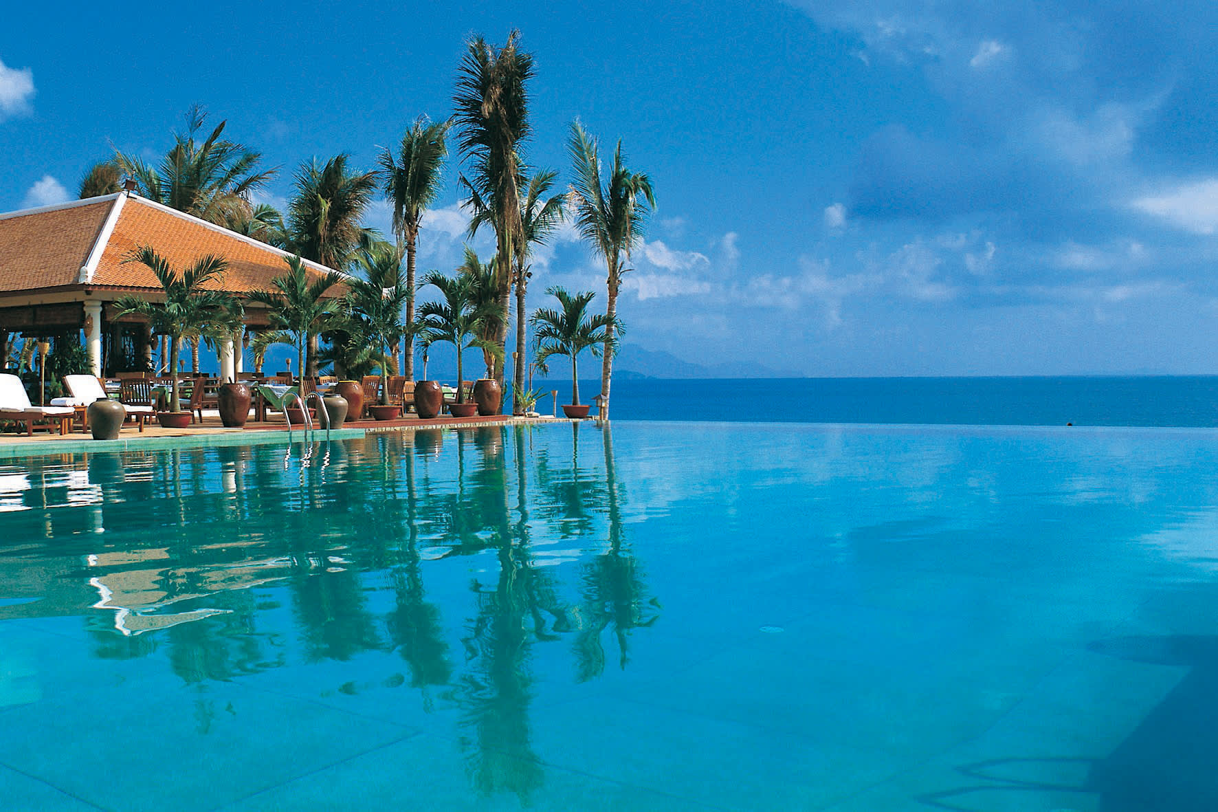 a house with a large pool of water