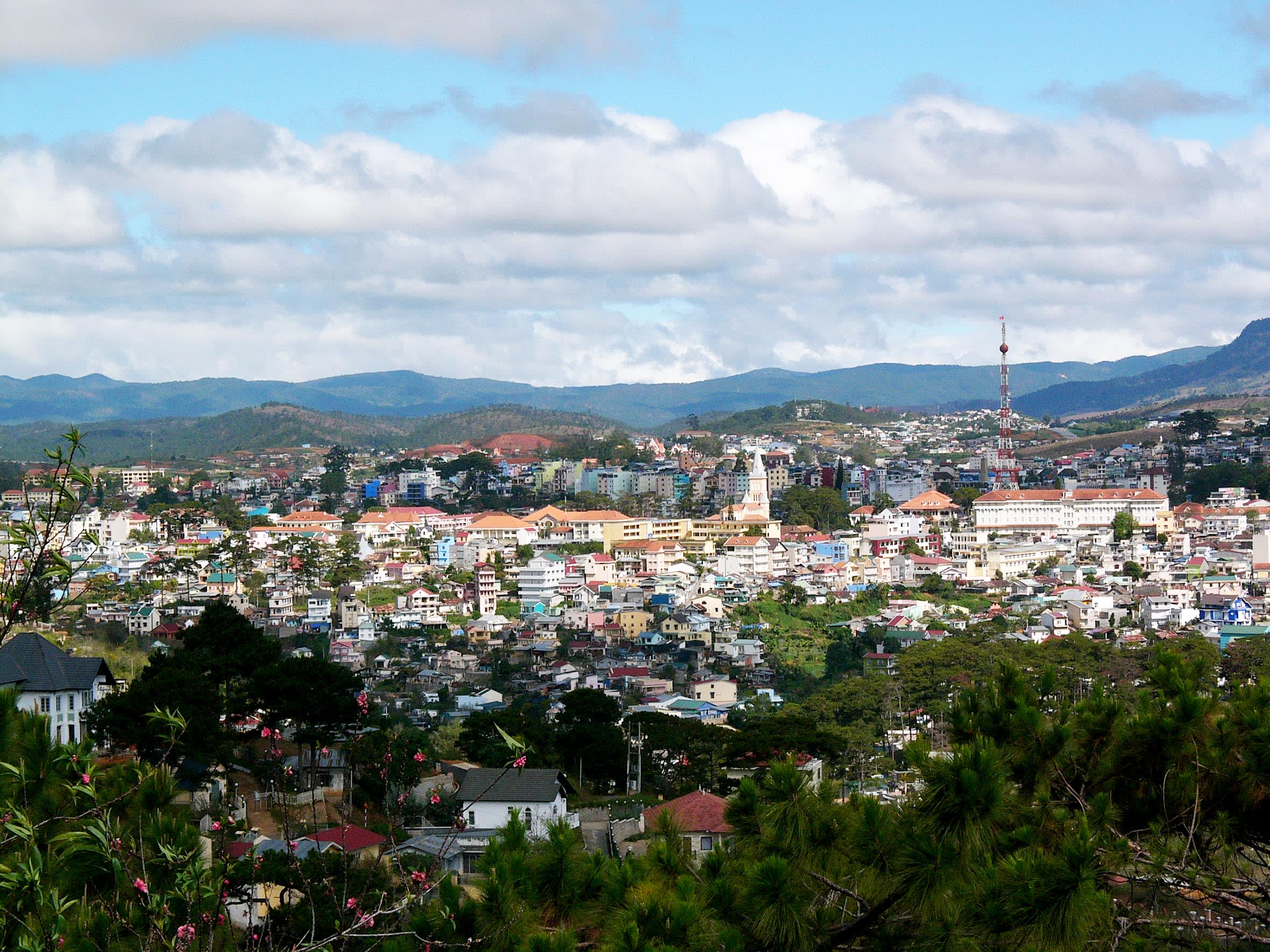 a large body of water with a city in the background