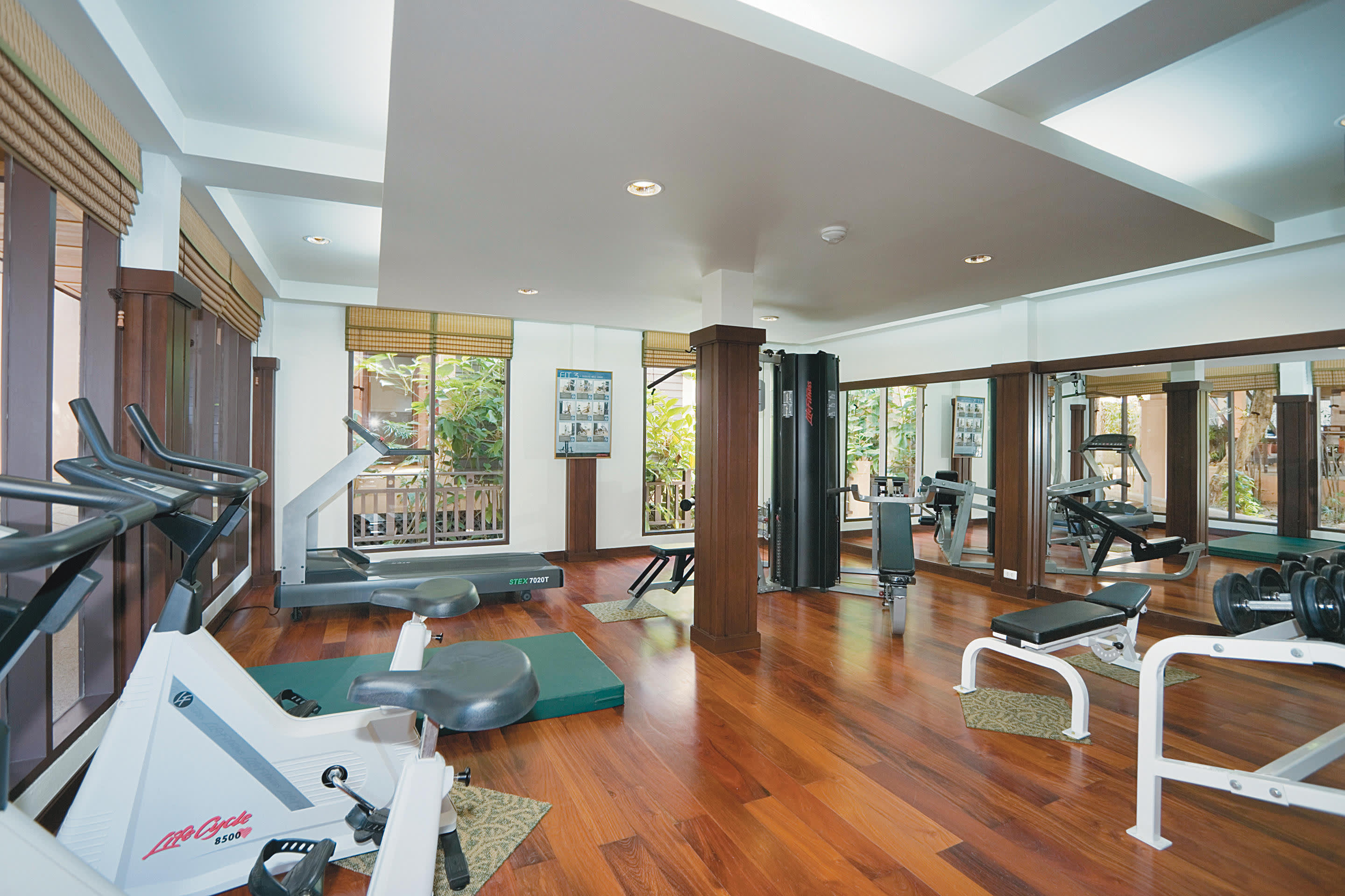 a living room filled with furniture and a large window