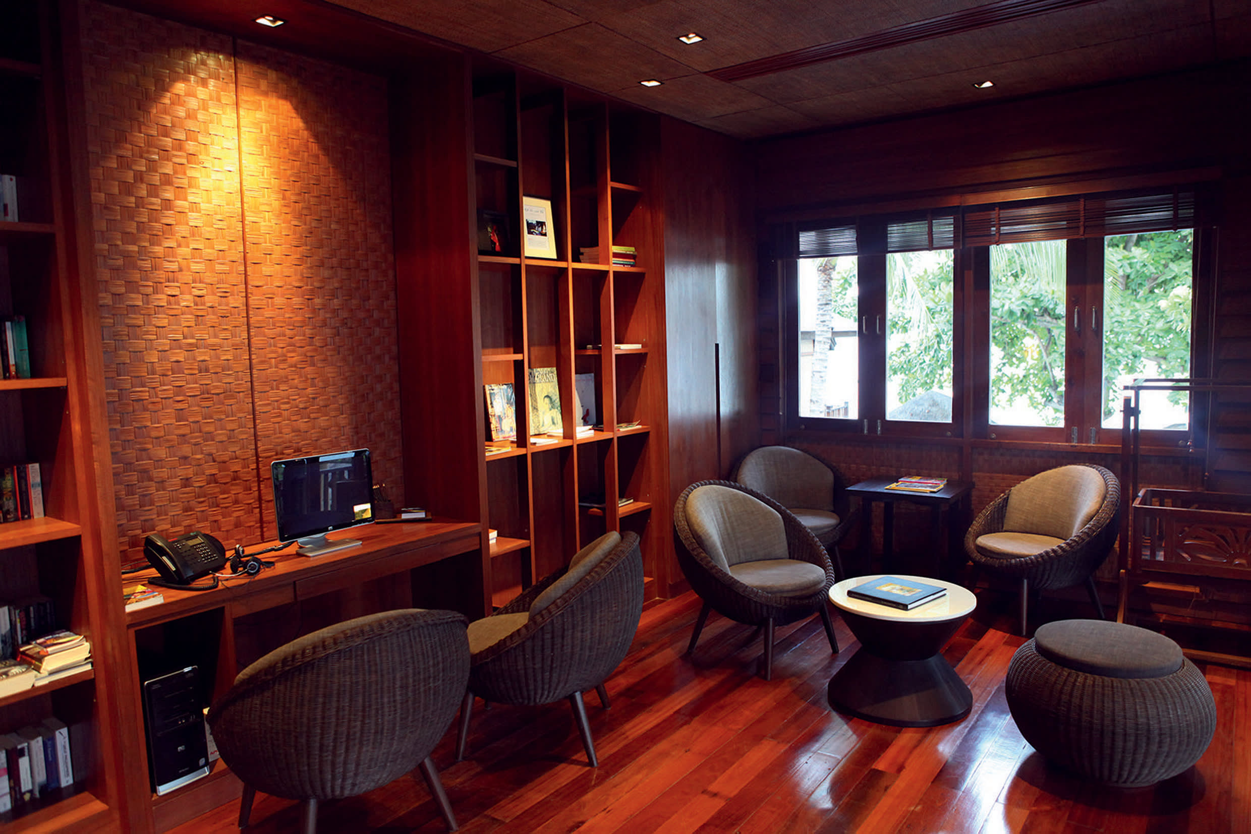 a living room filled with furniture and a large window