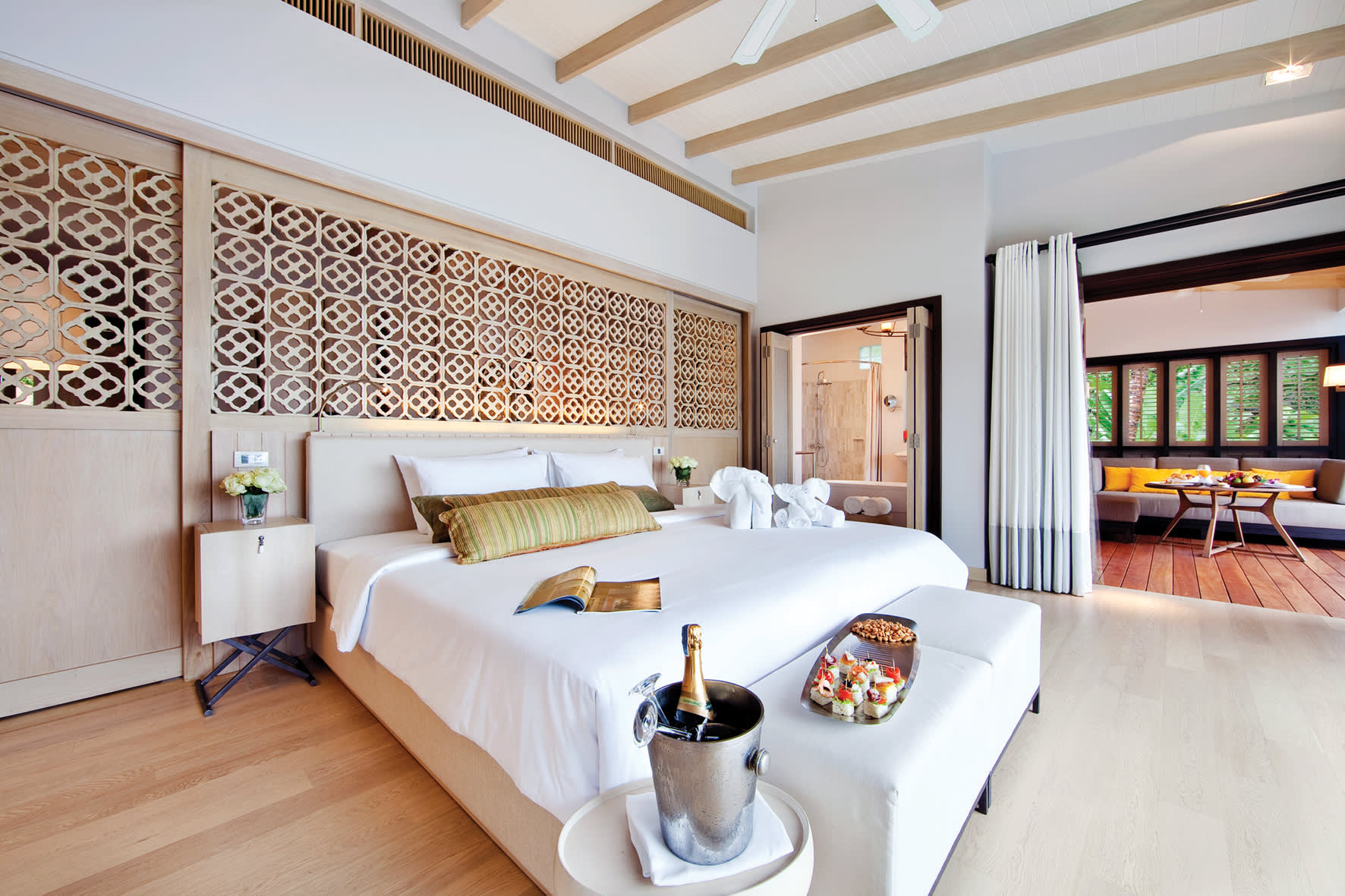 a living room filled with furniture and a large window