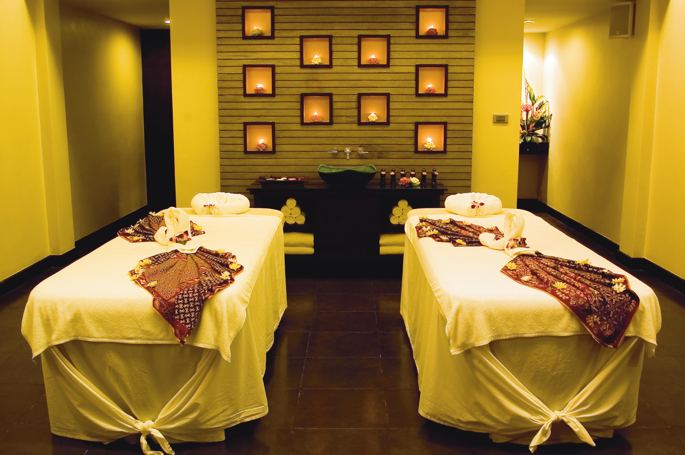 a bedroom with a bed and a mirror