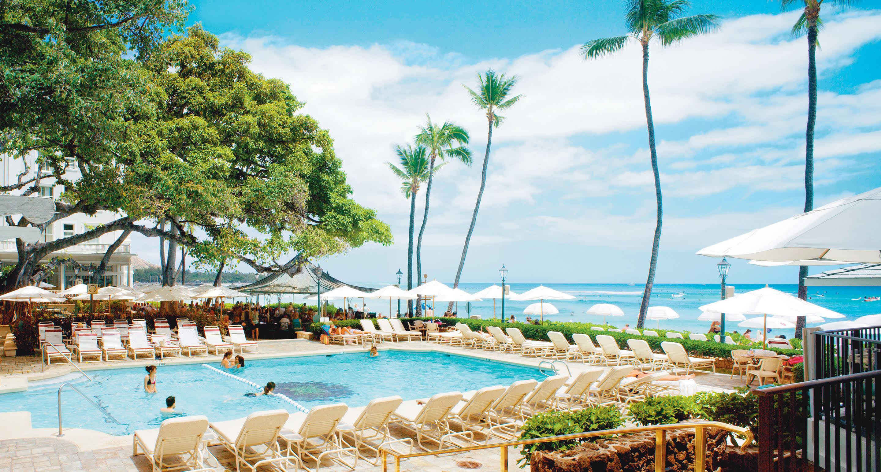 a group of lawn chairs sitting on top of a beach