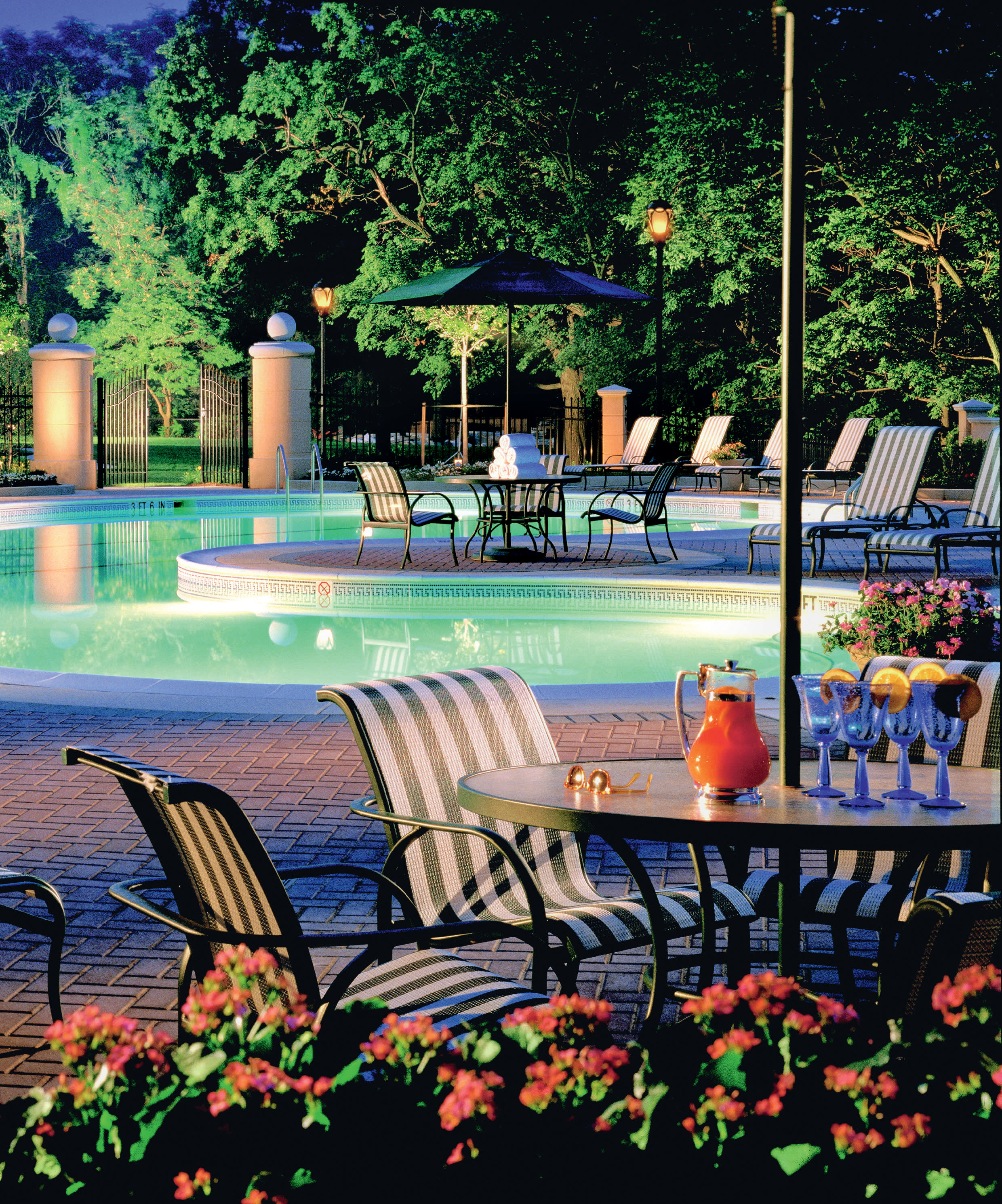 a vase of flowers sitting on a bench