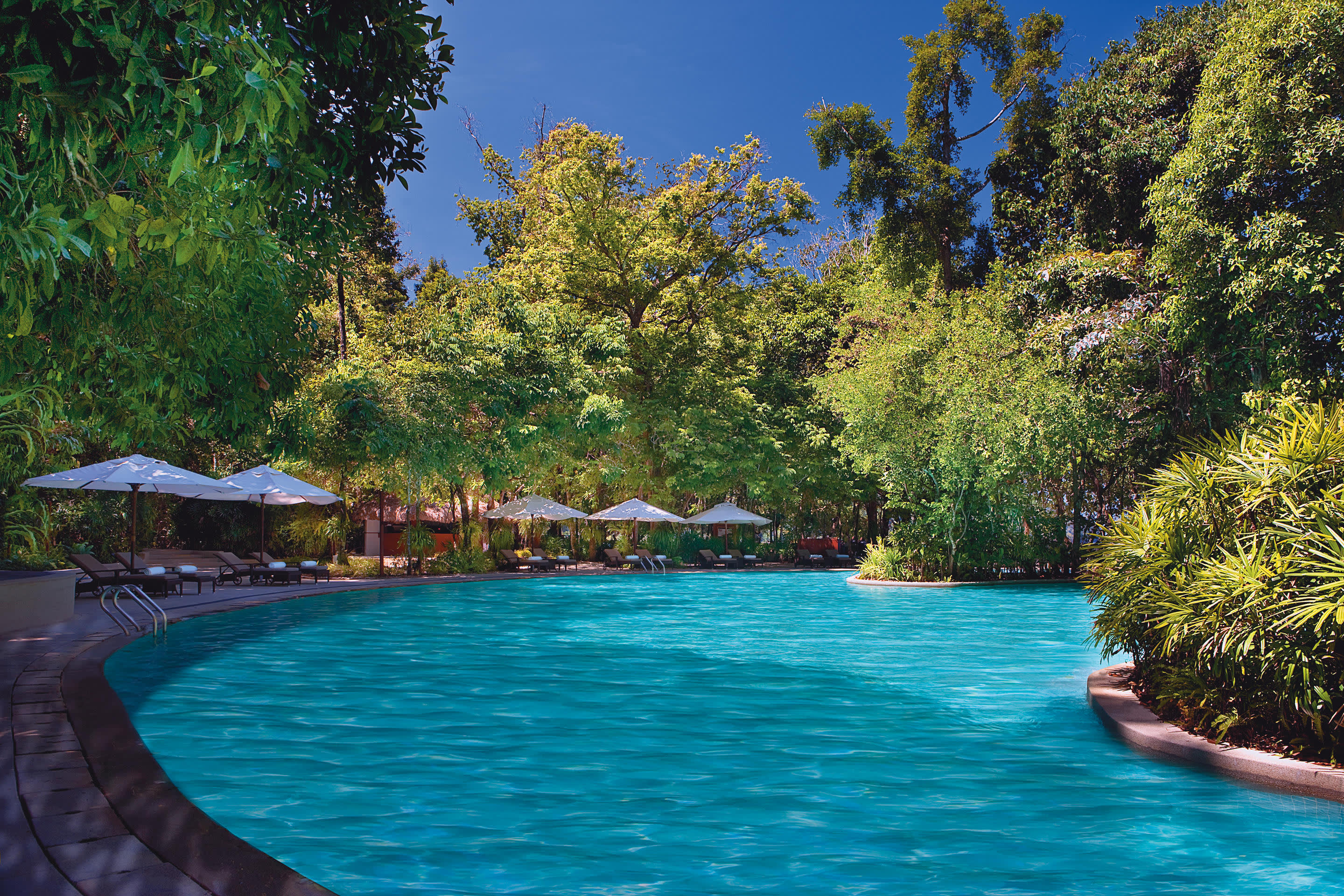 a pool next to a body of water