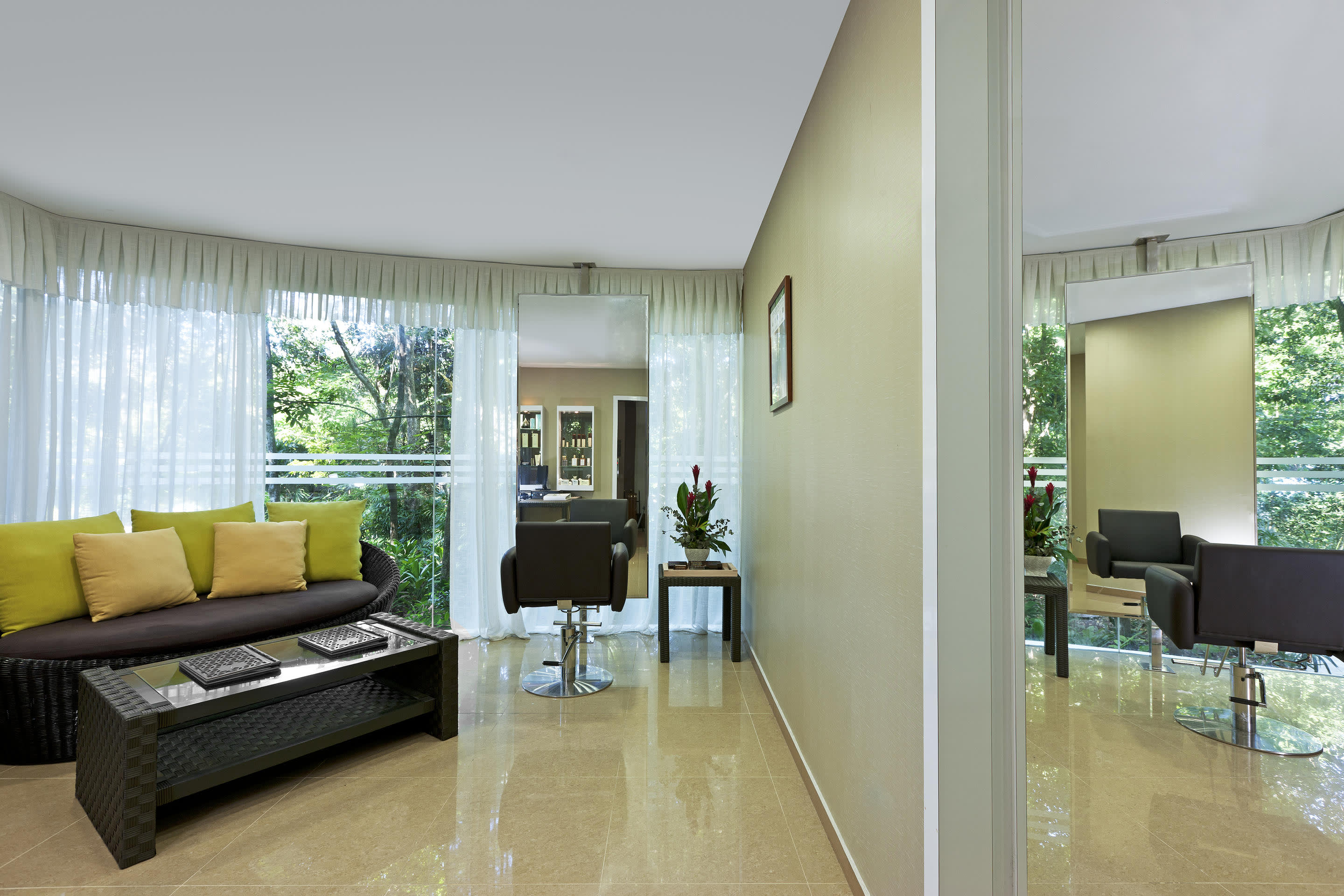 a living room filled with furniture and a large window