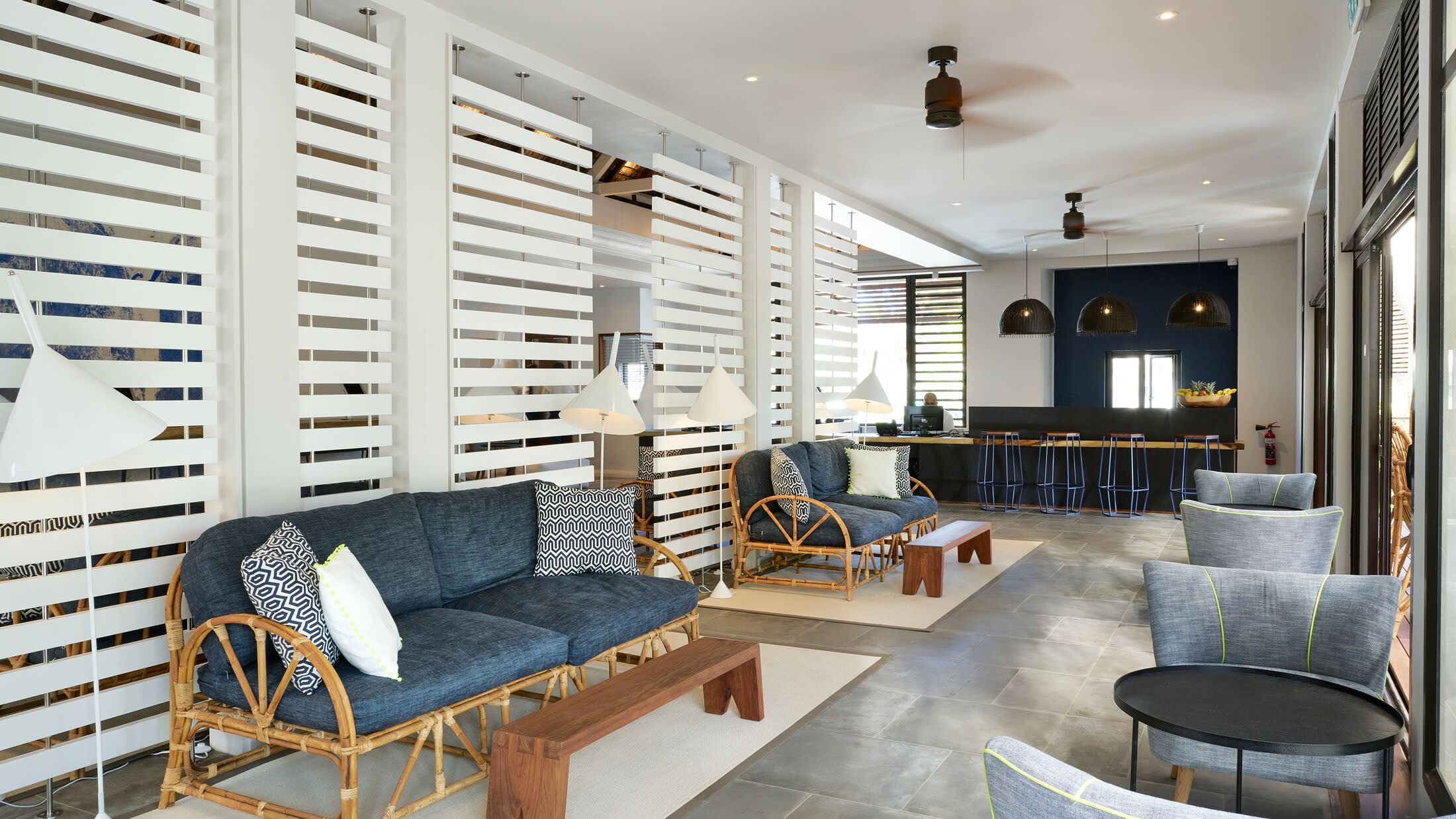 a living room filled with furniture and a large window