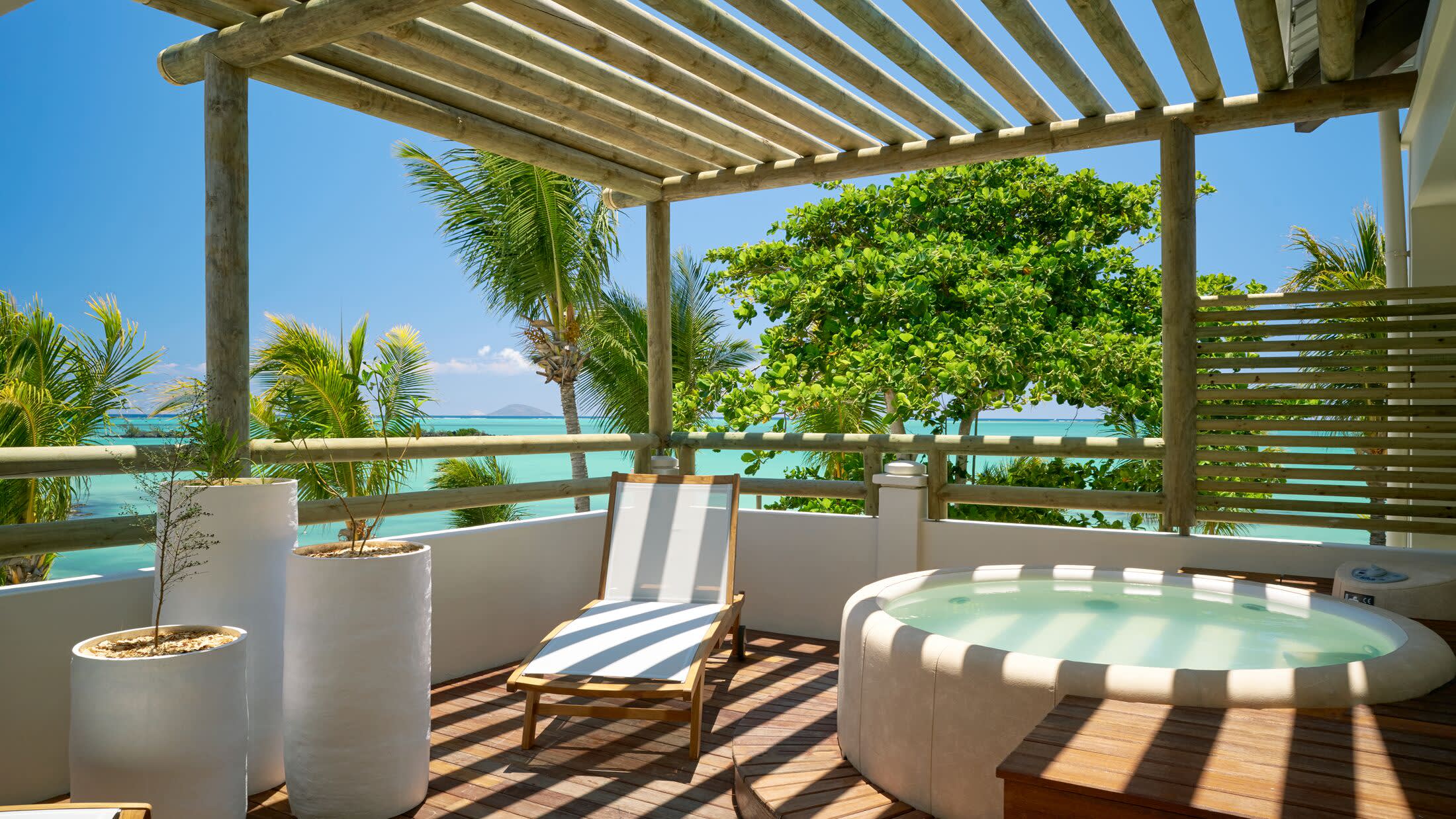 a dining room table in front of a pool