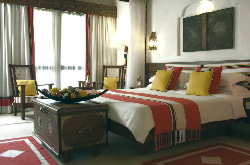 a bedroom with a large bed in a hotel room