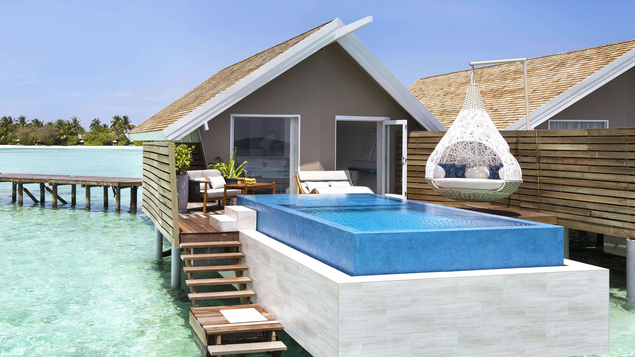 a wooden bench in front of a house