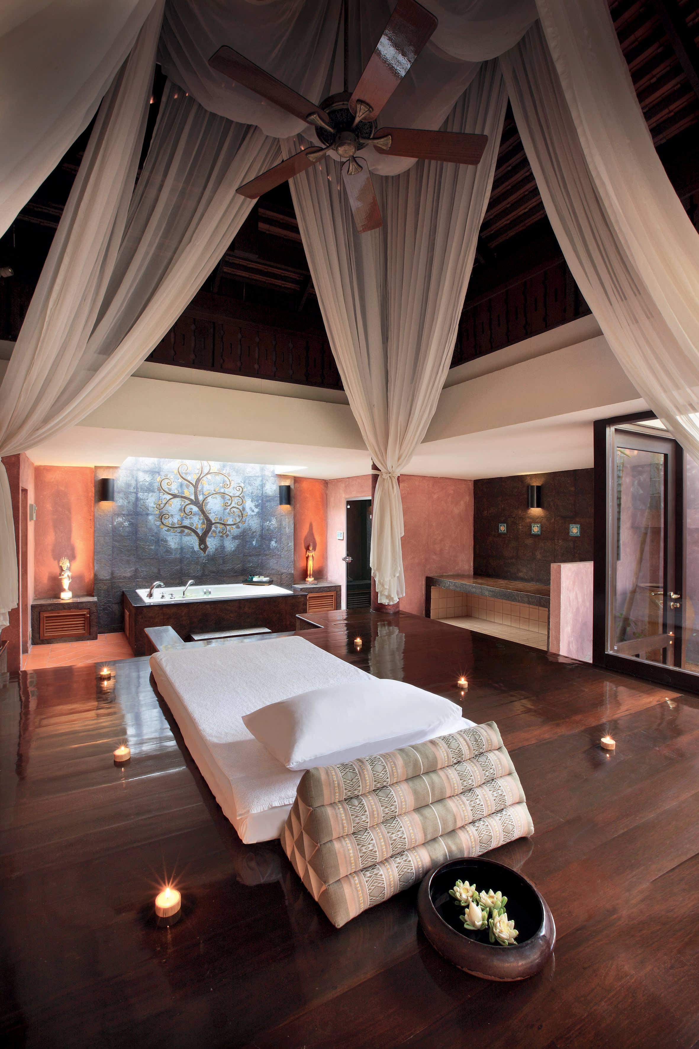 a living room filled with furniture and a fireplace