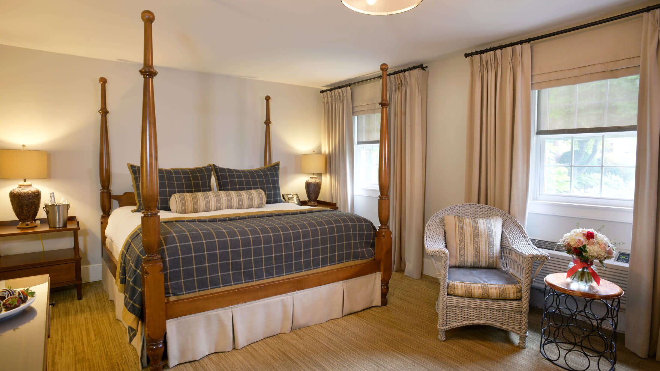 a bedroom with a bed and a chair in a room