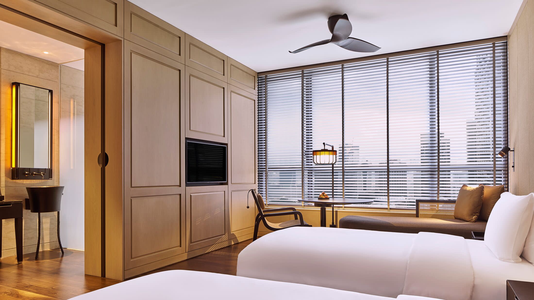 a living room filled with furniture and a large window