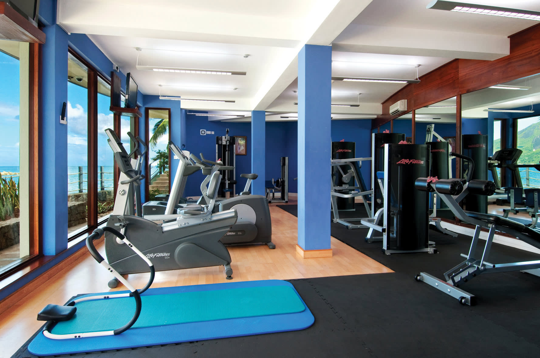 a room filled with furniture and a large window