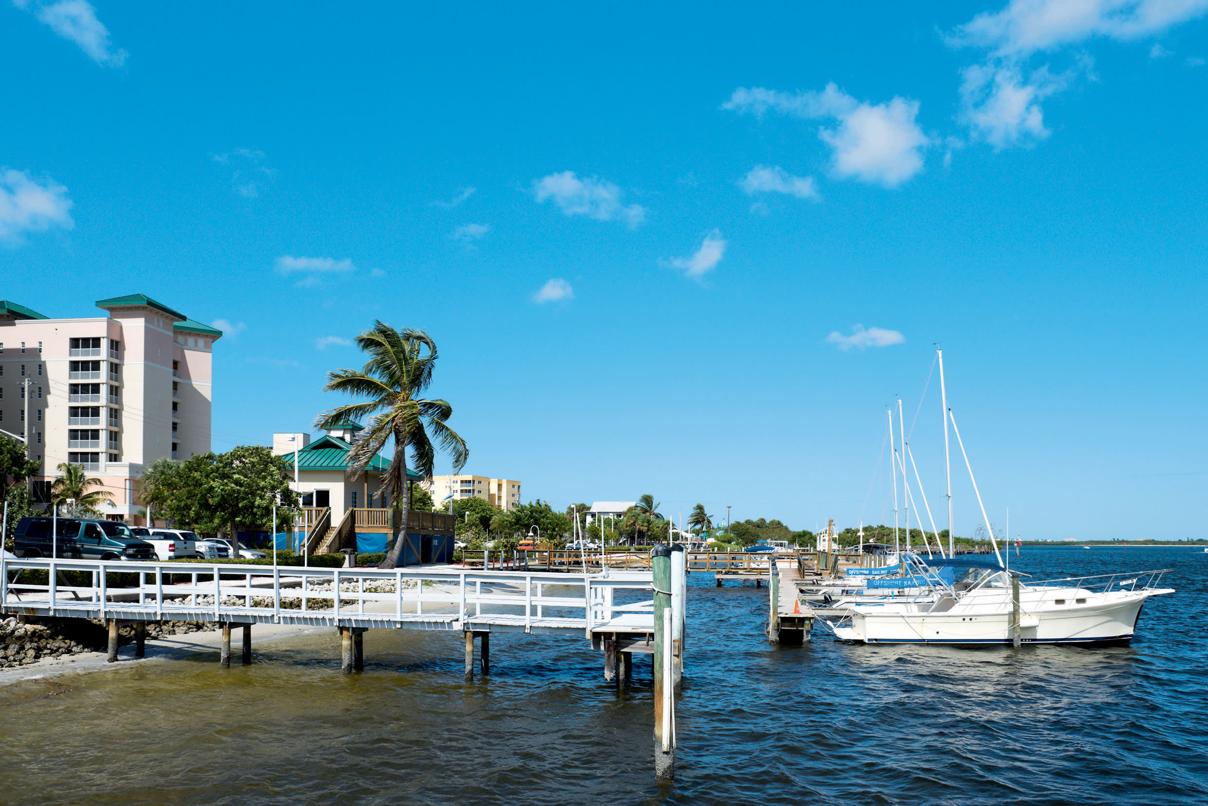a small boat in a harbor next to a body of water