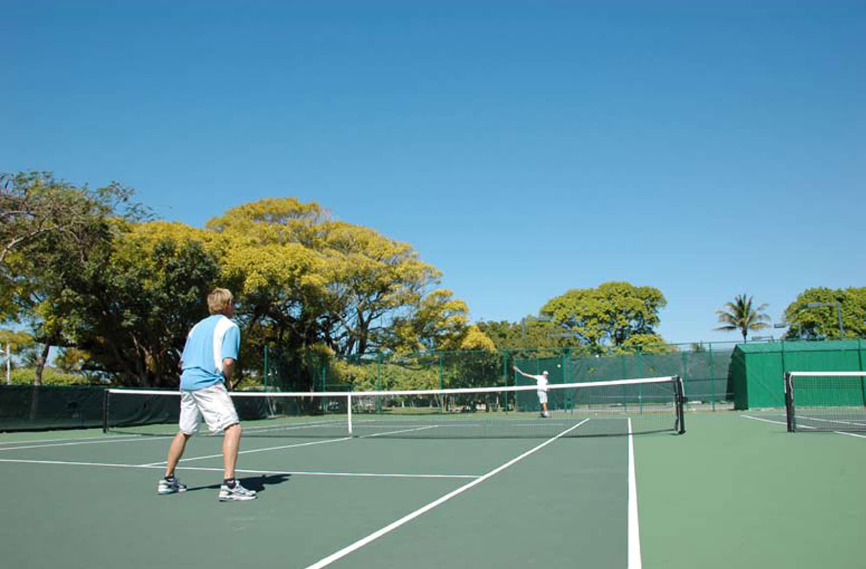 a man with a racket on a court