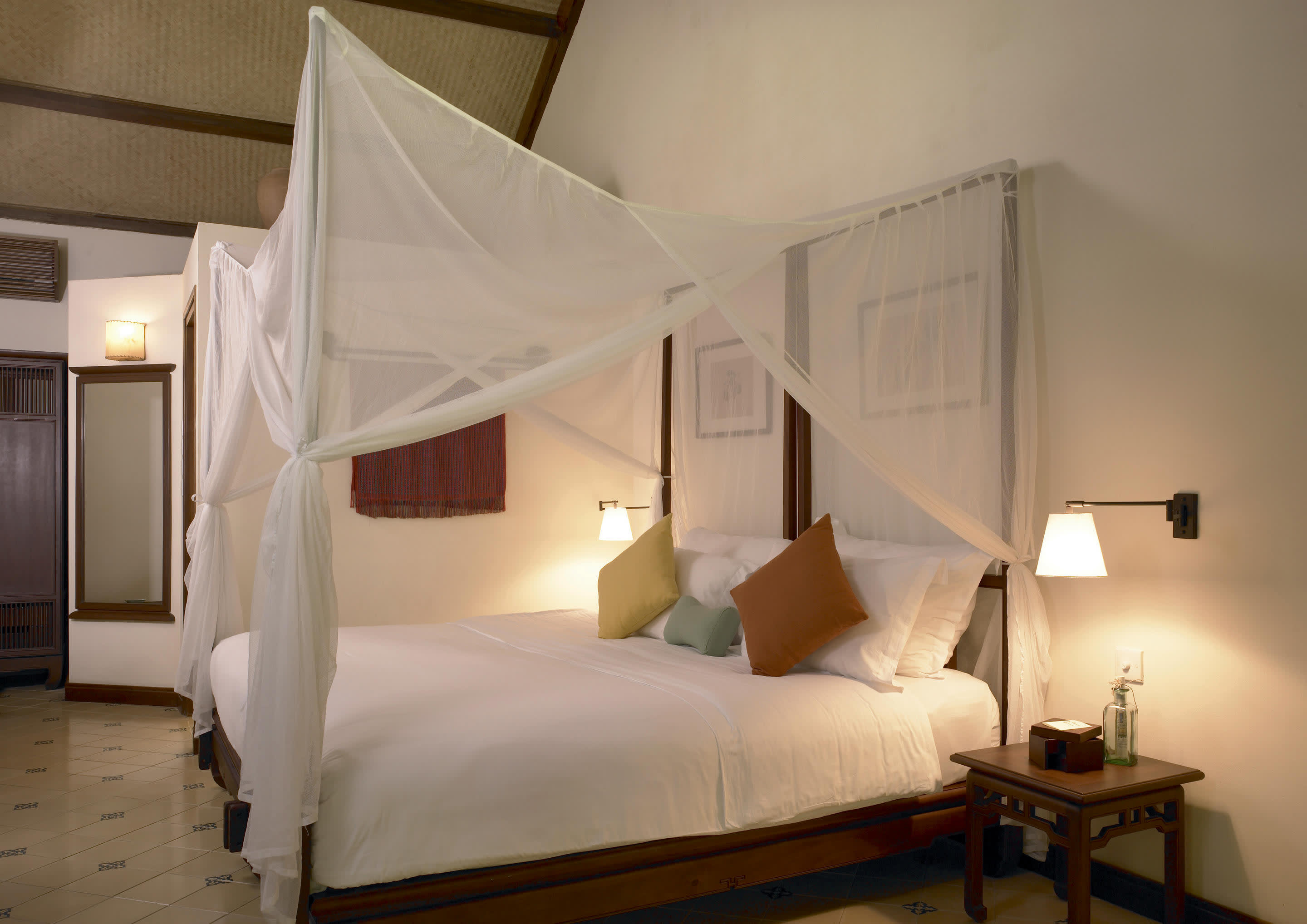 a bedroom with a bed in a room