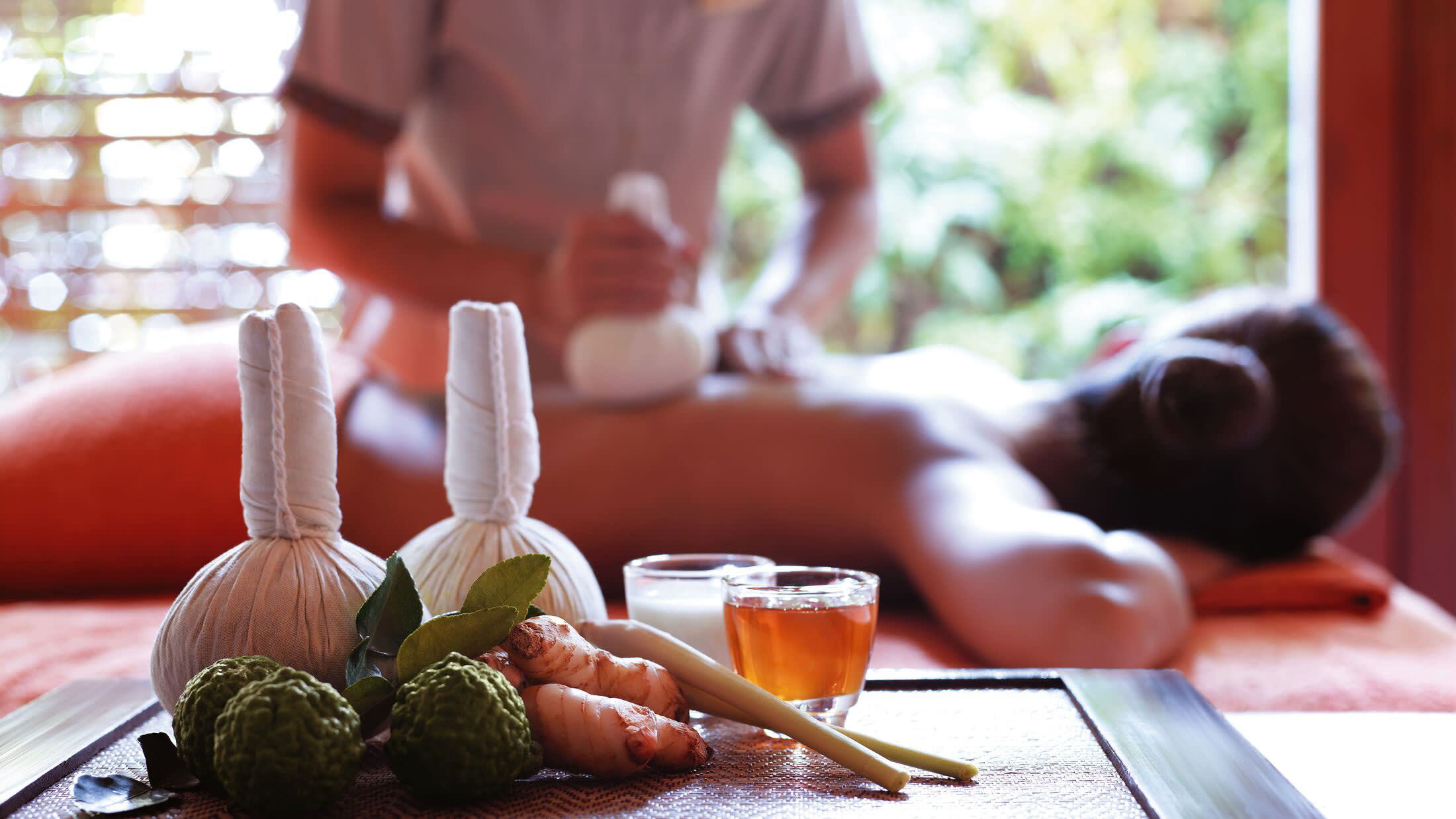 a person sitting at a table with a plate of food