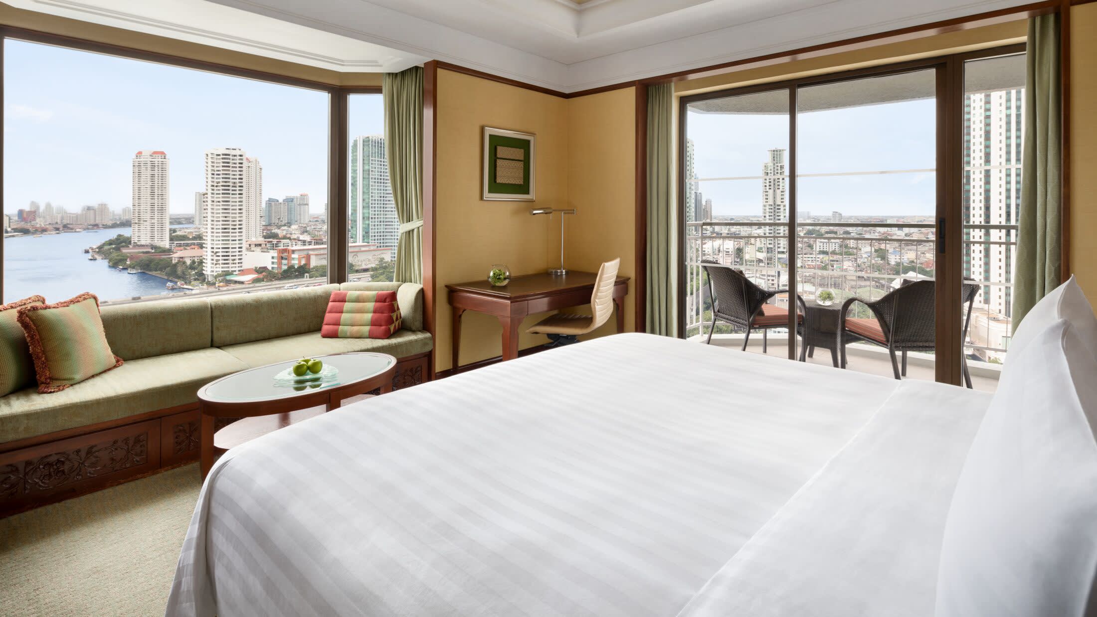 a bedroom with a large bed in a hotel room