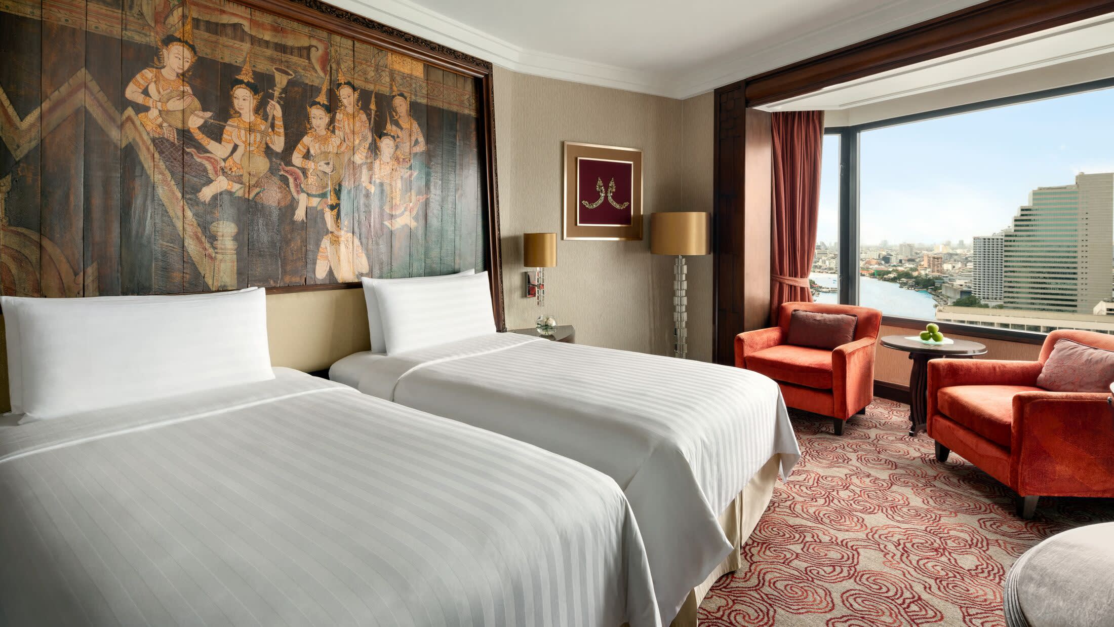 a bedroom with a large bed in a hotel room