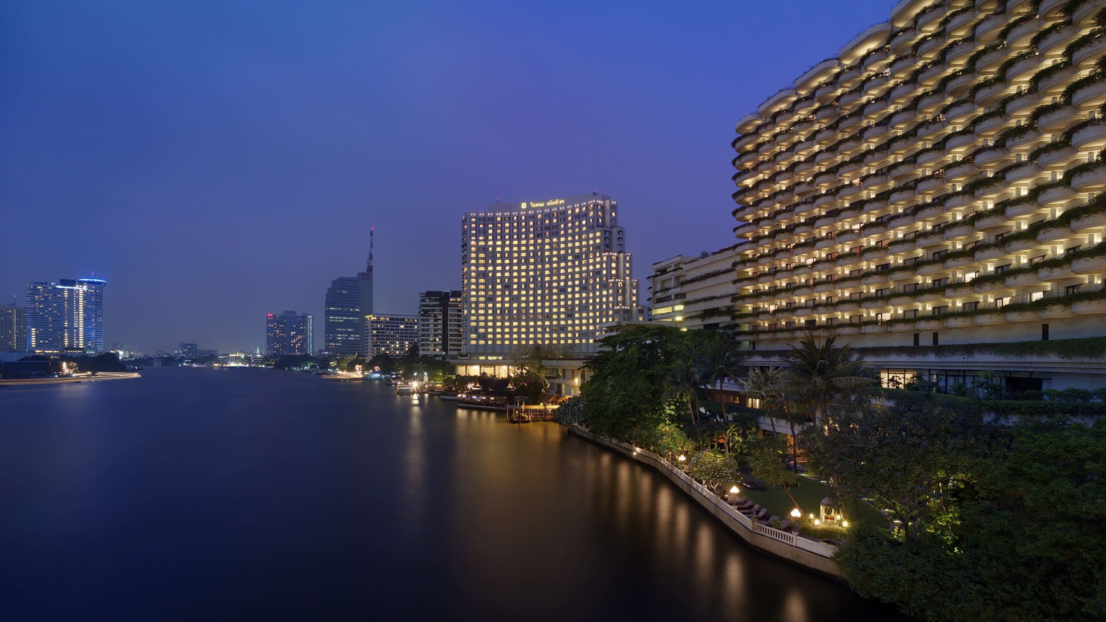 a large body of water with a city in the background