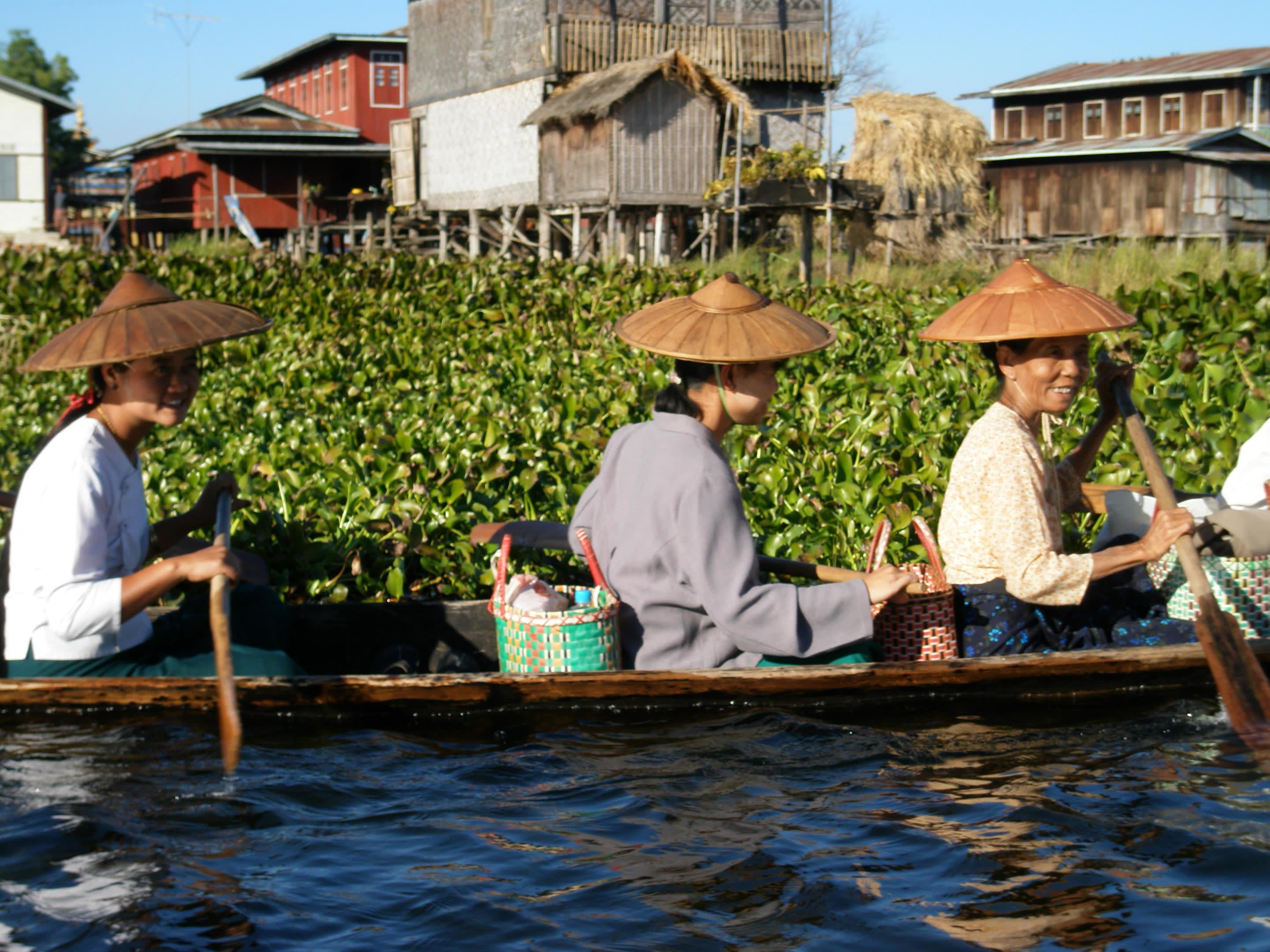 a group of people on a boat in the water