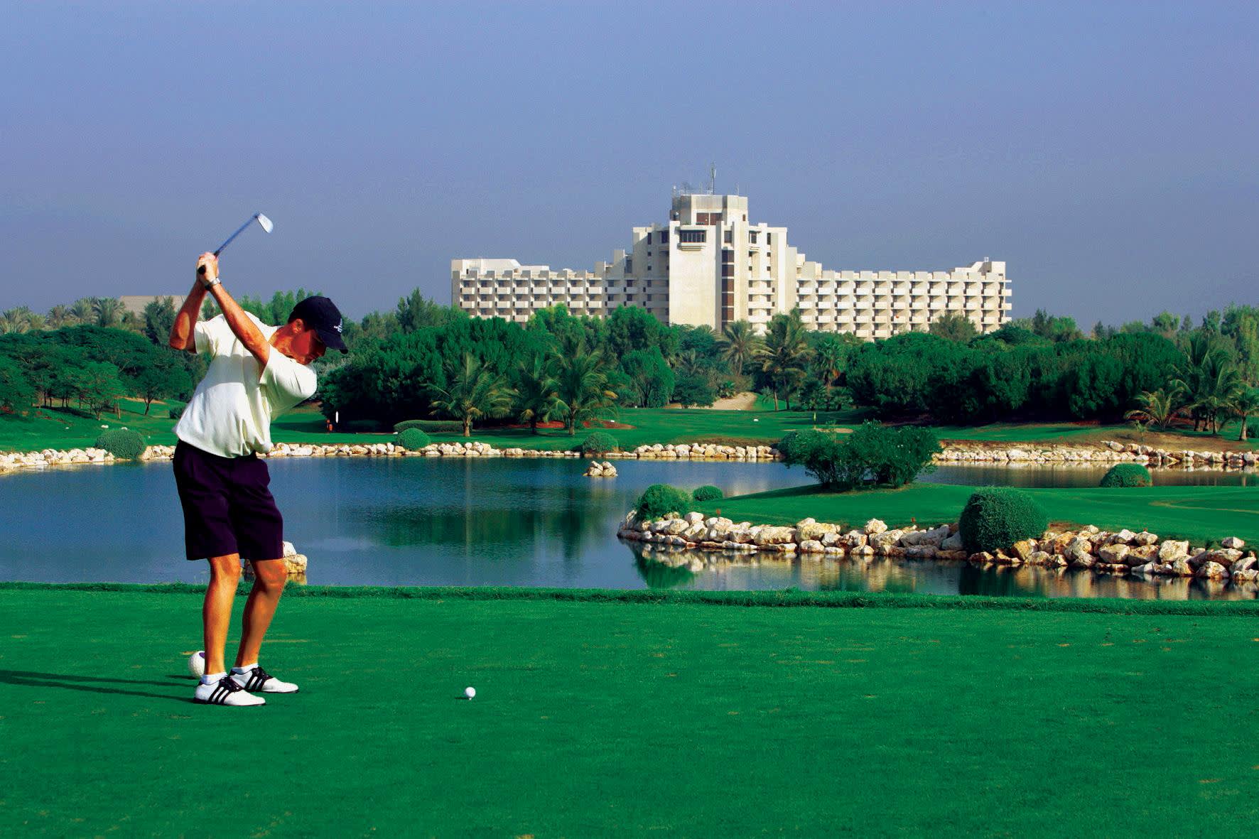 a person standing next to a body of water