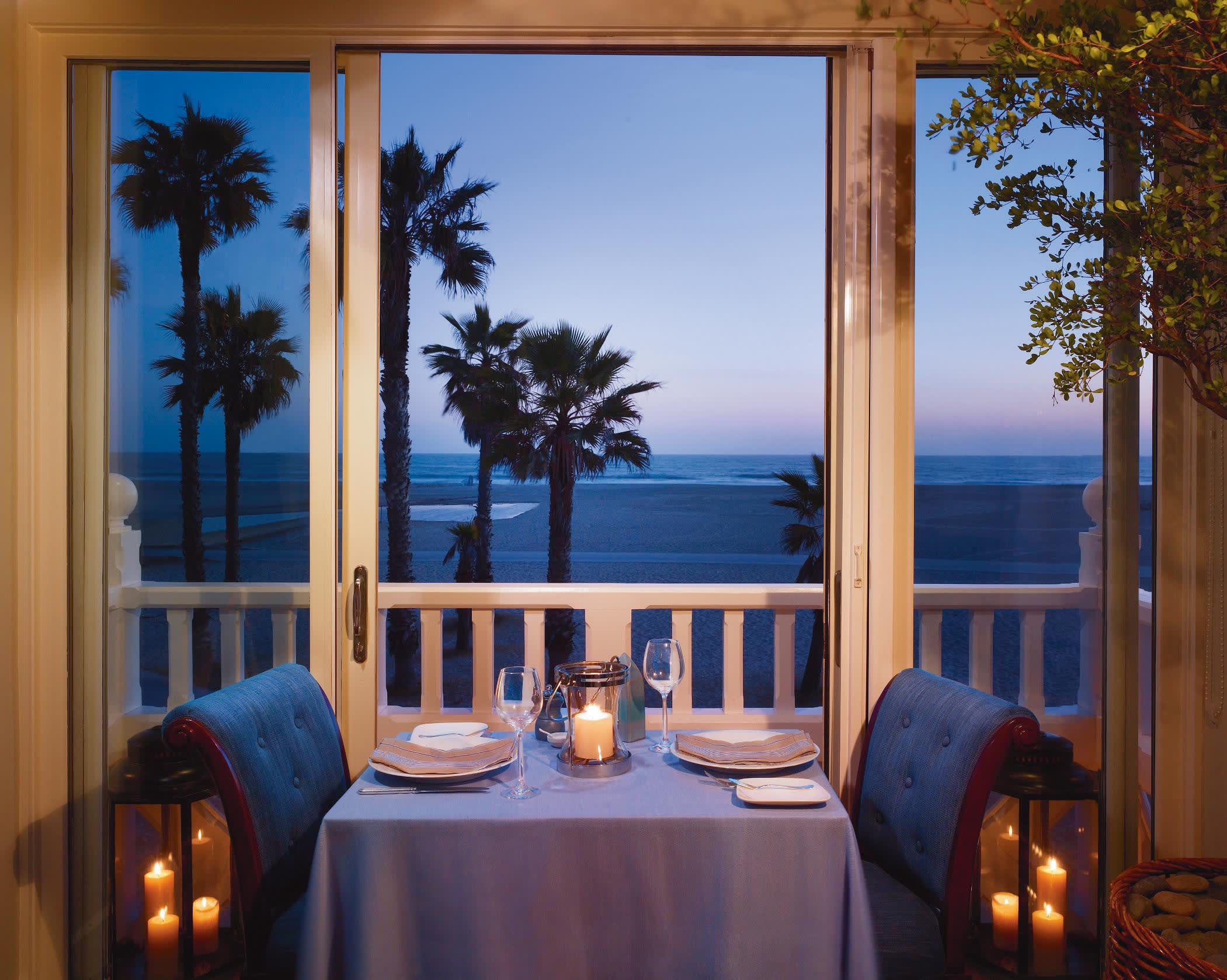 a dining room table in front of a window