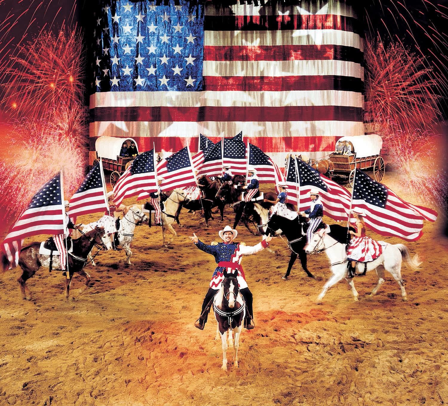 a group of people walking down a dirt road