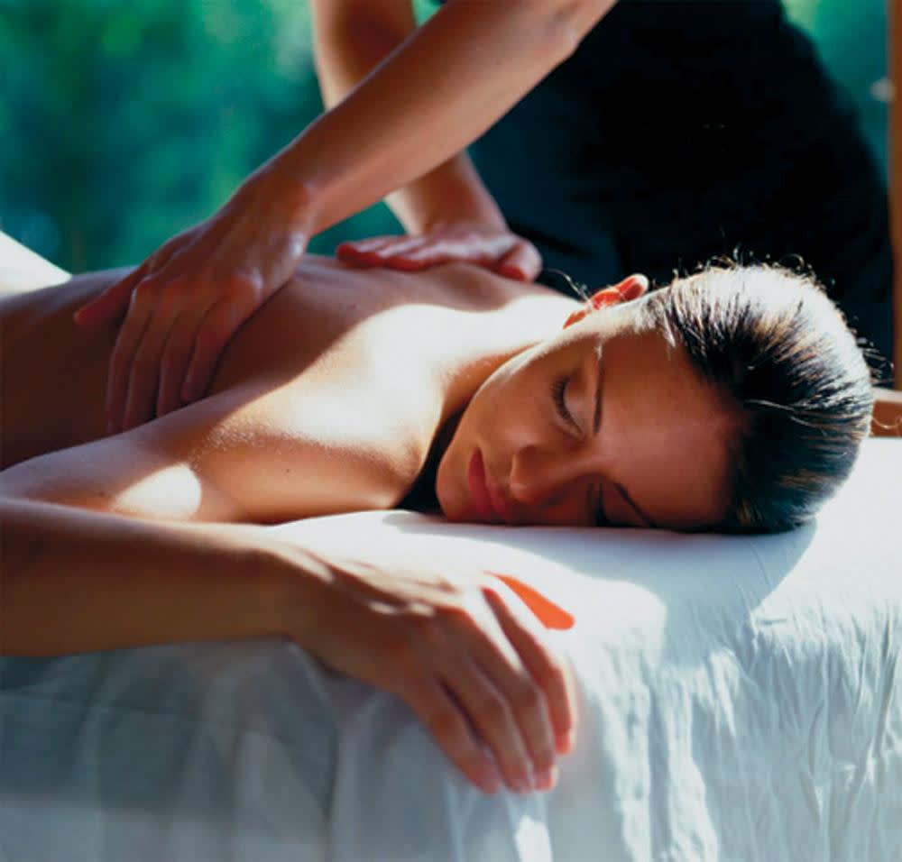 a woman lying on a bed