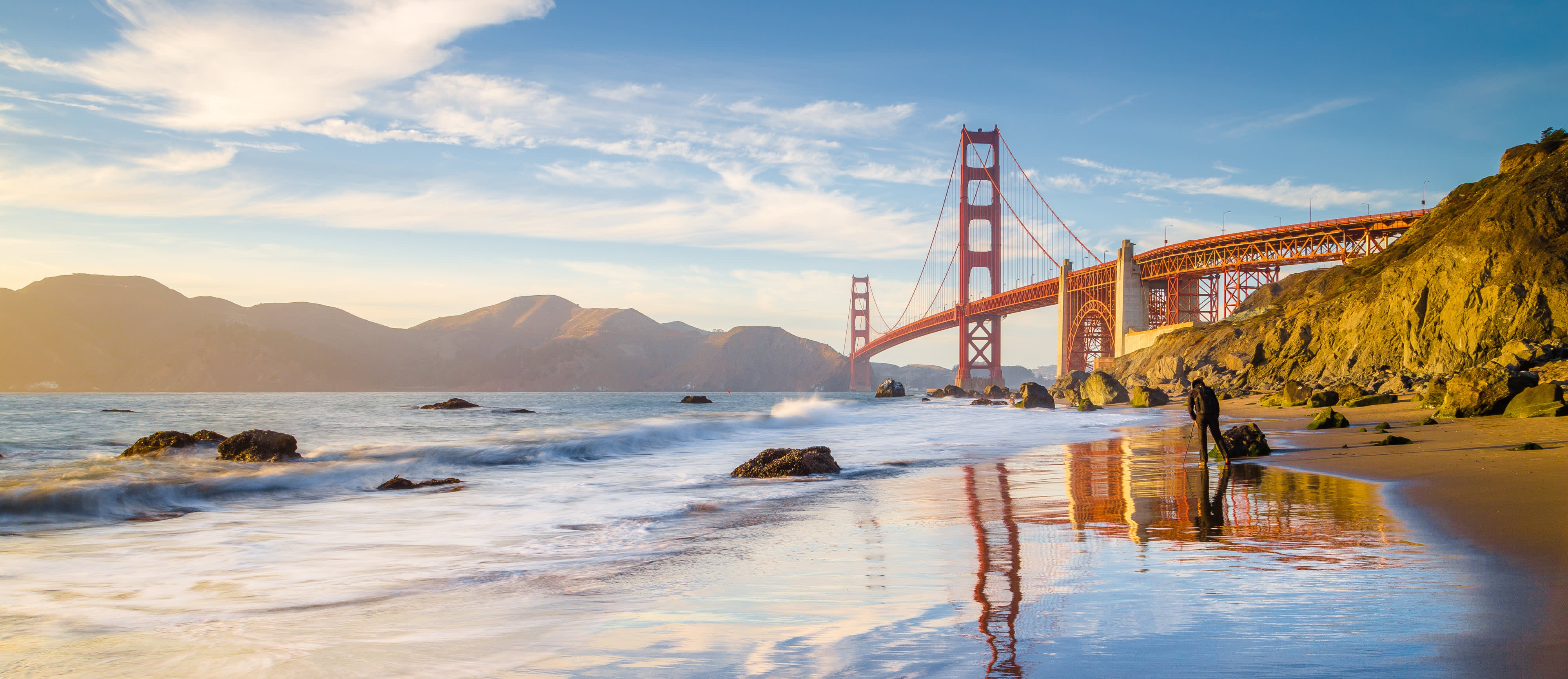 panoramic view of famous Golden Gate Bridge seen from scenic Baker Beach