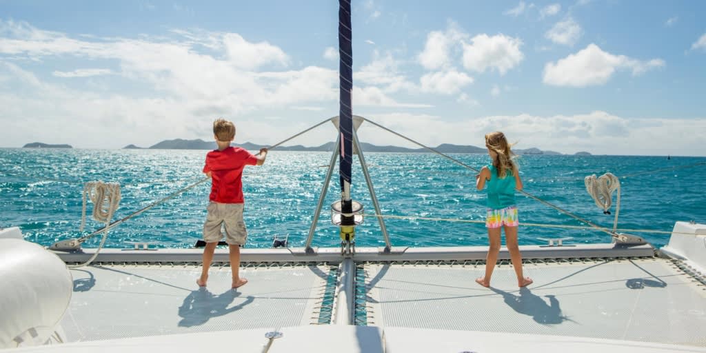 Children on catamaran trampoline in the BVI