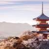 Enchanting Travels Asia Tours Sunset at Kiyomizu-dera Temple and cherry blossom season (Sakura) on spring time in Kyoto, Japan