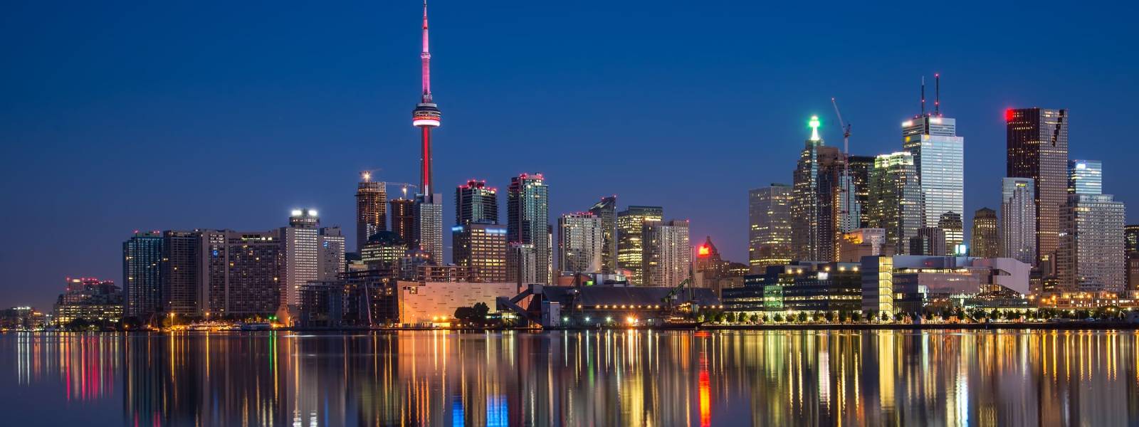 a body of water with a city in the background