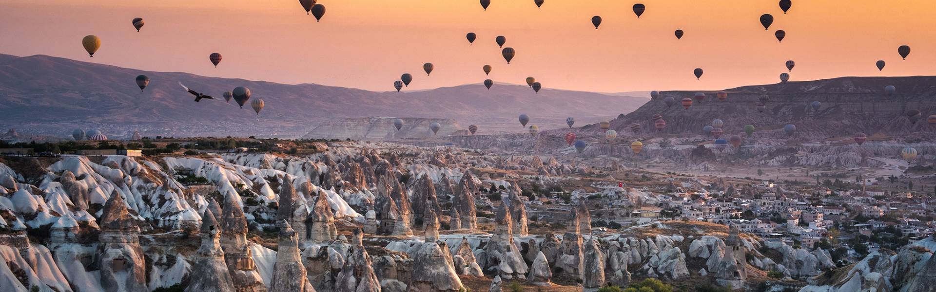 hot air balloons, rock formations, sunset