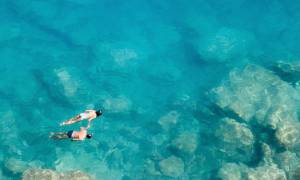 Couple snorkeling, Maldives, Asia - history of Maldives
