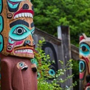Detail of totem pole at Saxman Village tribal house near Ketchikan Alaska