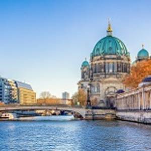 Enchanting Travels Germany Tours Berlin Cathedral (Berliner Dom) and Museum Island (Museumsinsel) reflected in Spree River, Berlin, Germany, Europe